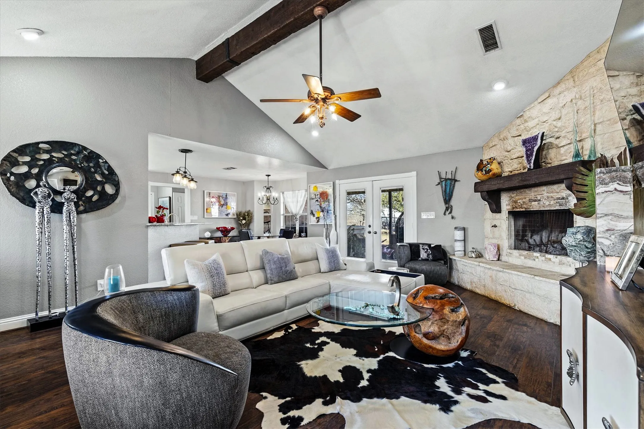 LIVING ROOM...Stone WB Fireplace W/Gas Starter, Laminate Floor, Vaulted Beamed Ceiling