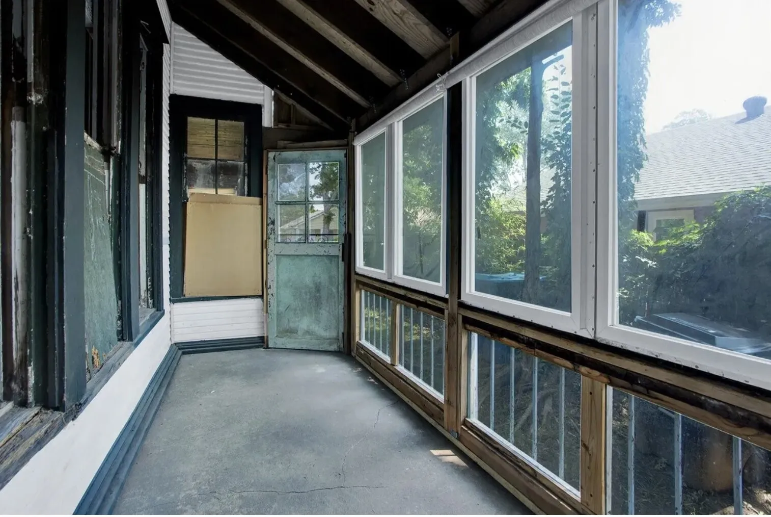 Unfurnished sunroom featuring plenty of natural light