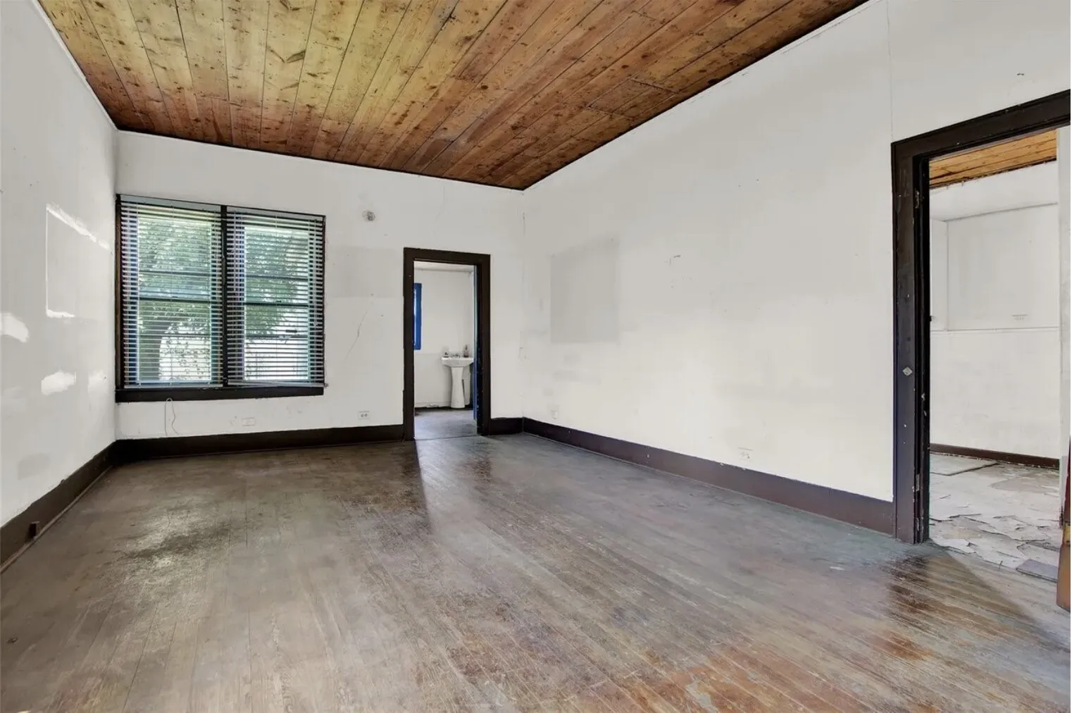 Unfurnished room with wood finished floors and wood ceiling