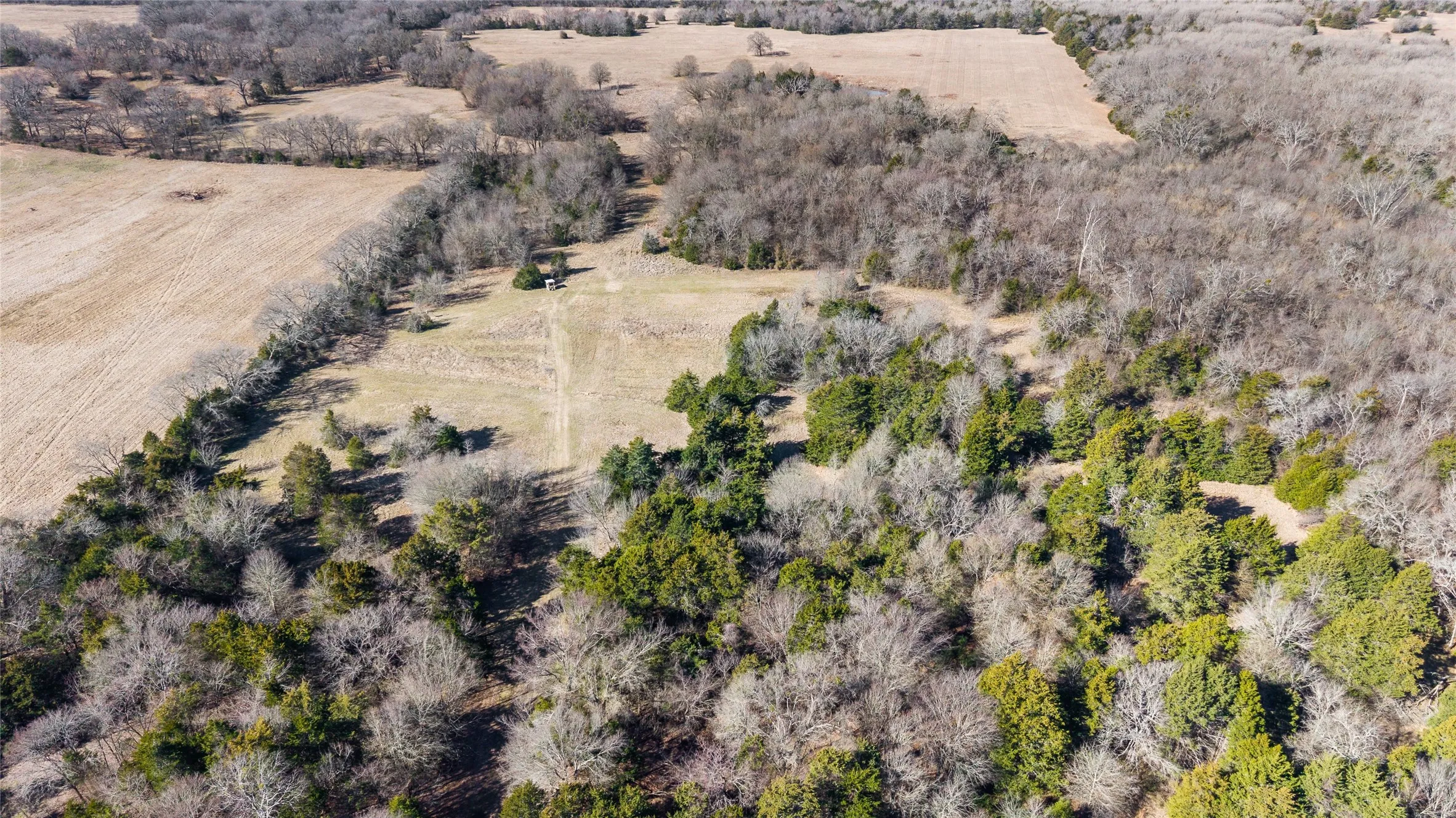 Aerial view of property and surrounding area featuring rural landscape