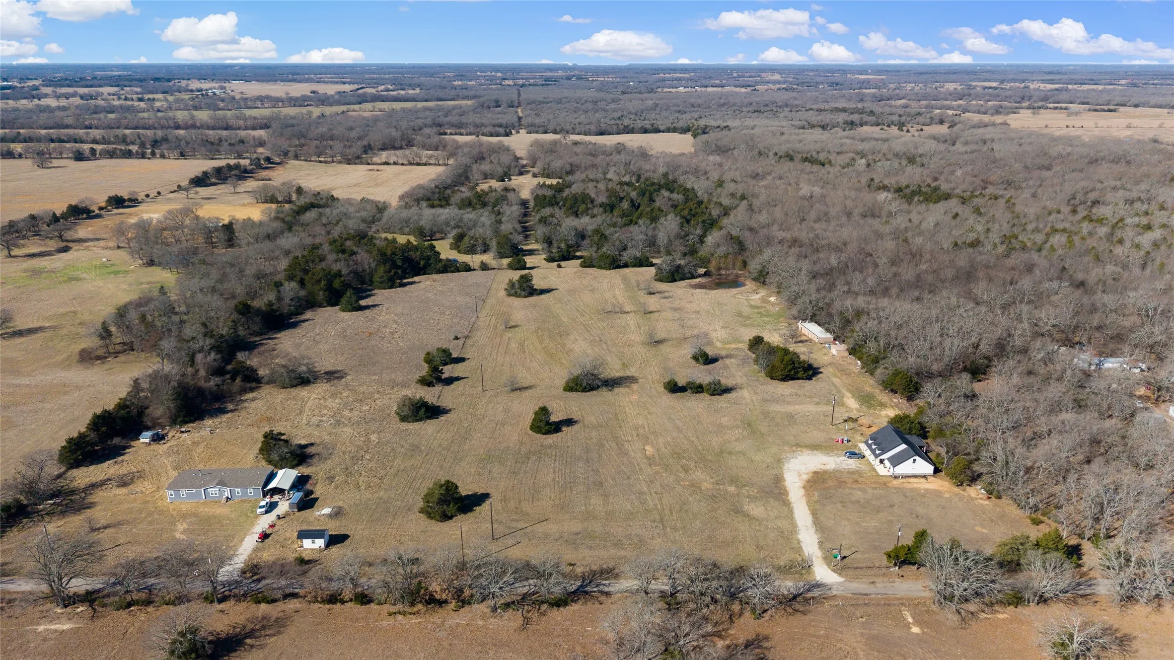 Aerial view of property and surrounding area with rural landscape