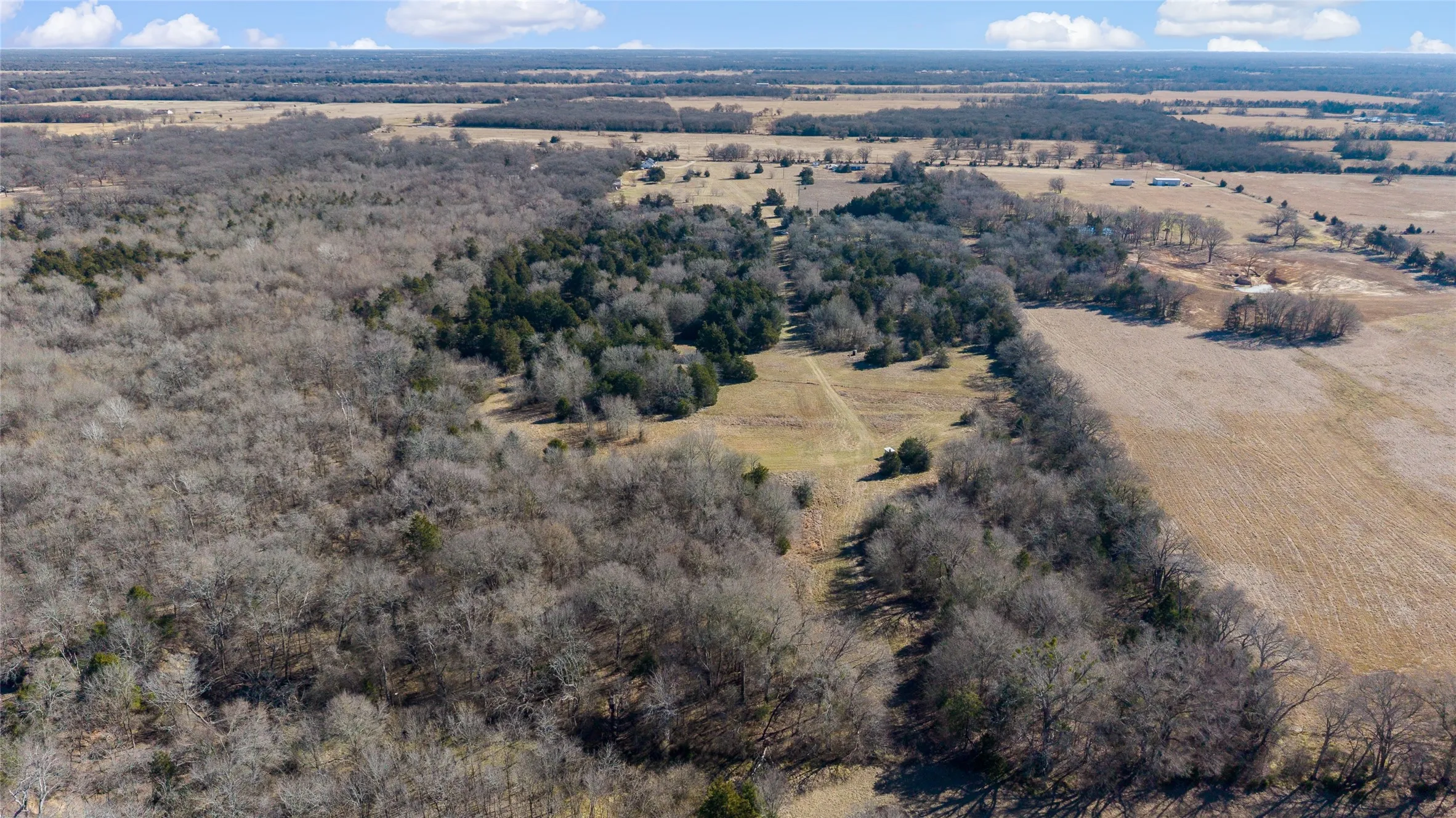 Aerial view of property and surrounding area featuring rural landscape