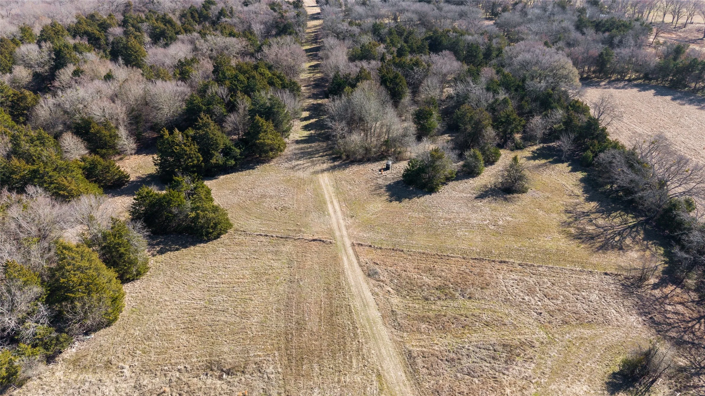 Aerial view of property and surrounding area featuring rural landscape