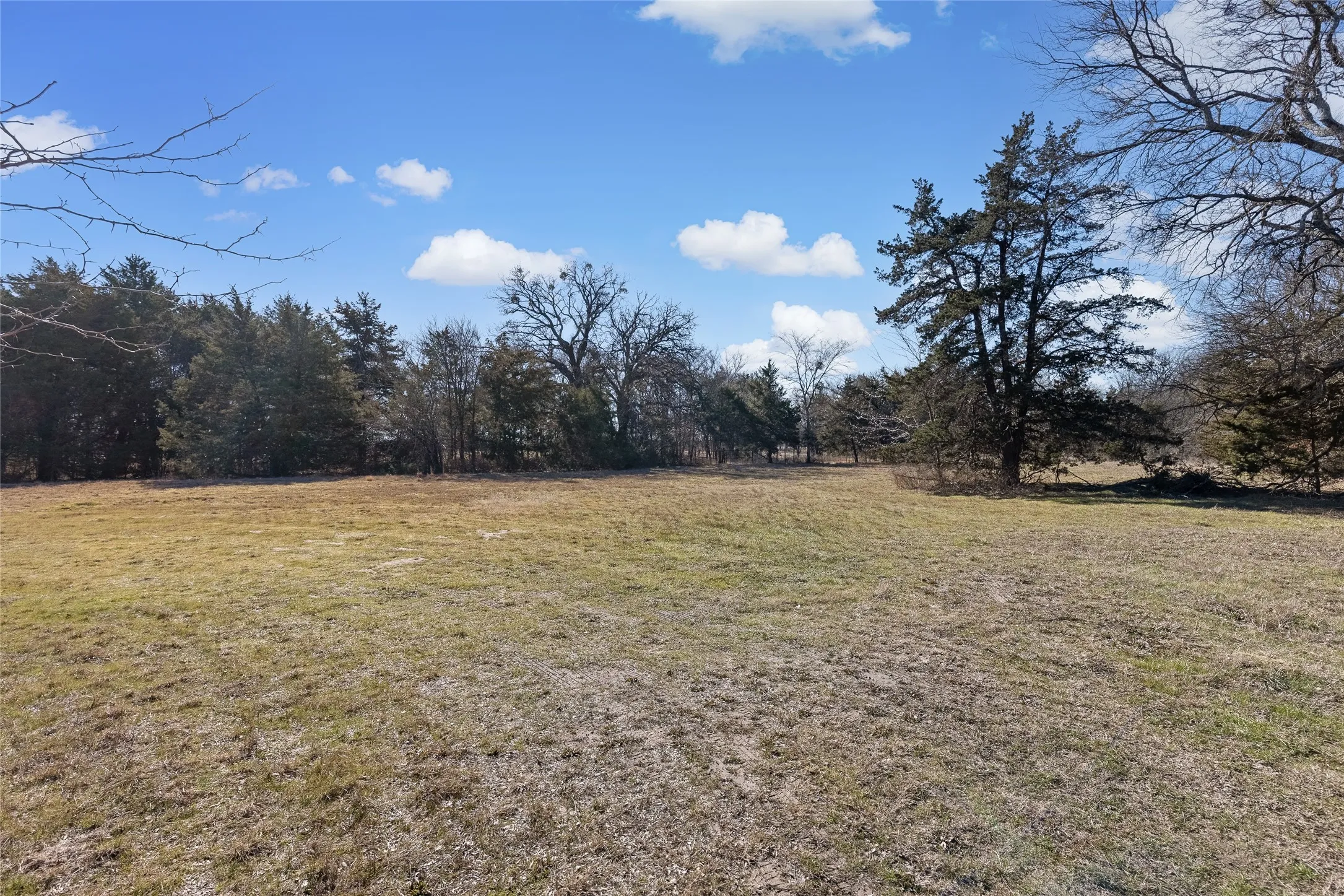 View of green lawn featuring a view of rural / pastoral area
