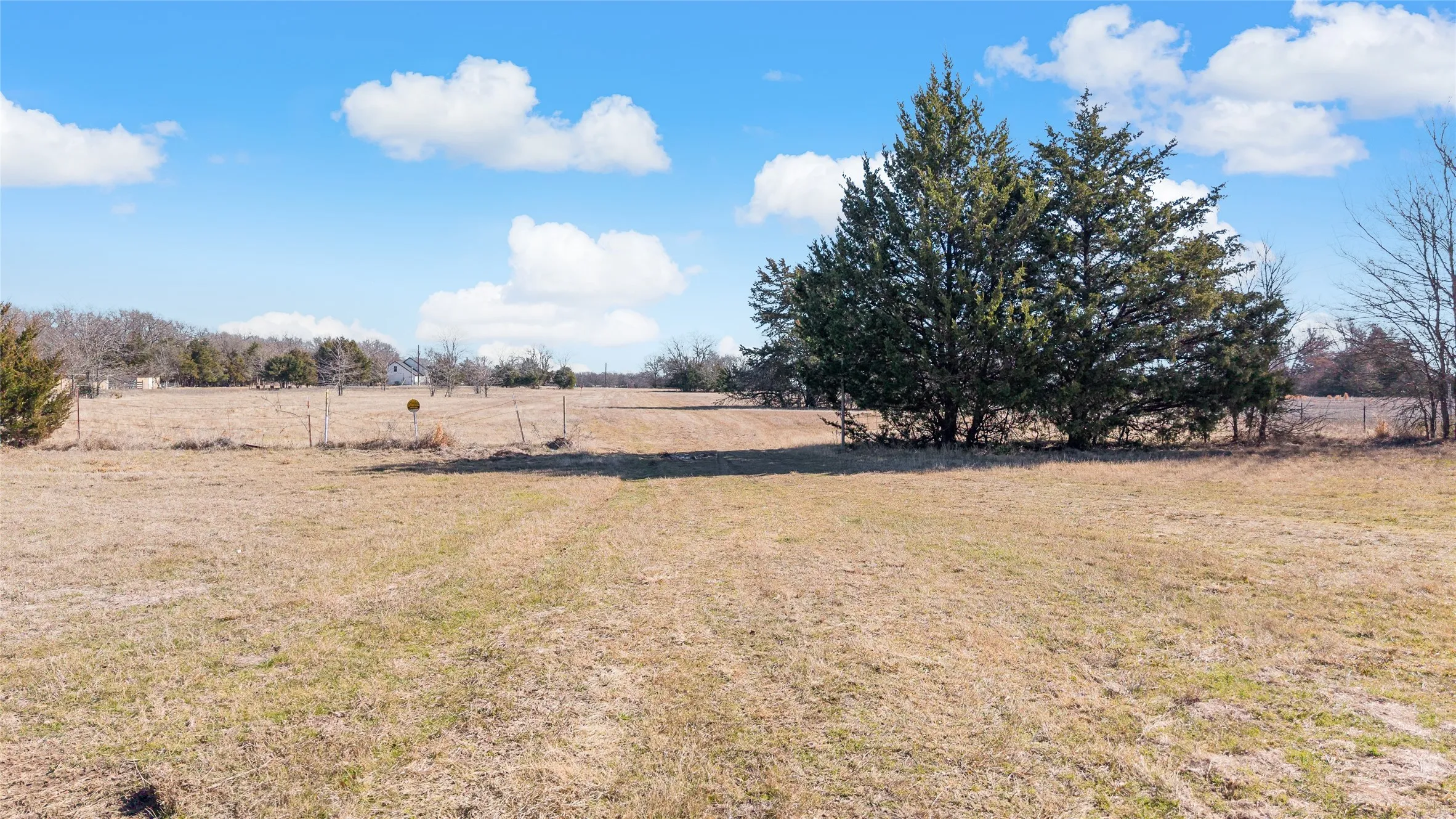 View of green lawn featuring a rural view