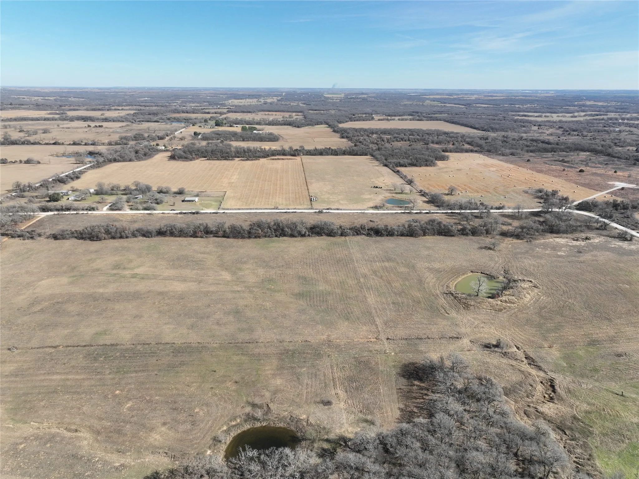 Aerial view of property's location featuring rural landscape and rows of crops