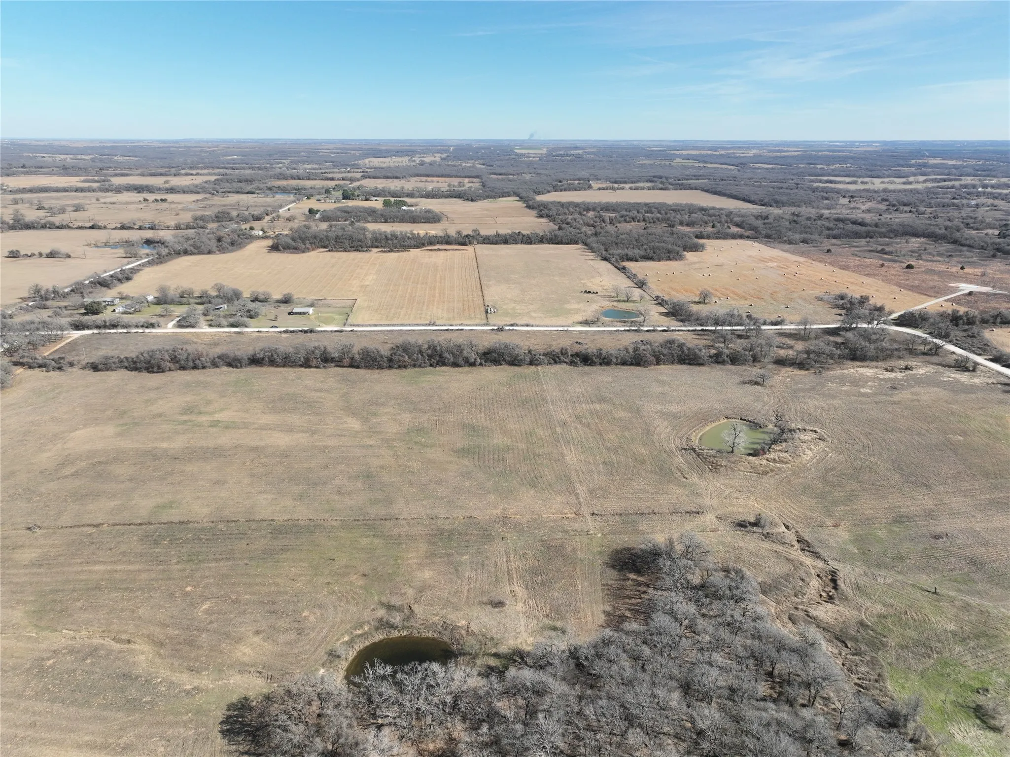 Aerial view of property's location with rural landscape and farmland