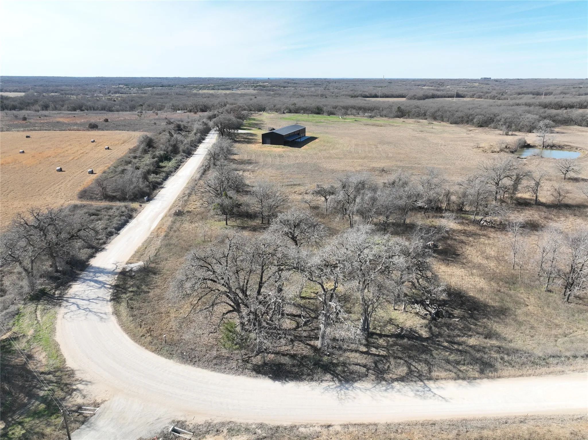 Aerial view of property and surrounding area featuring rural landscape