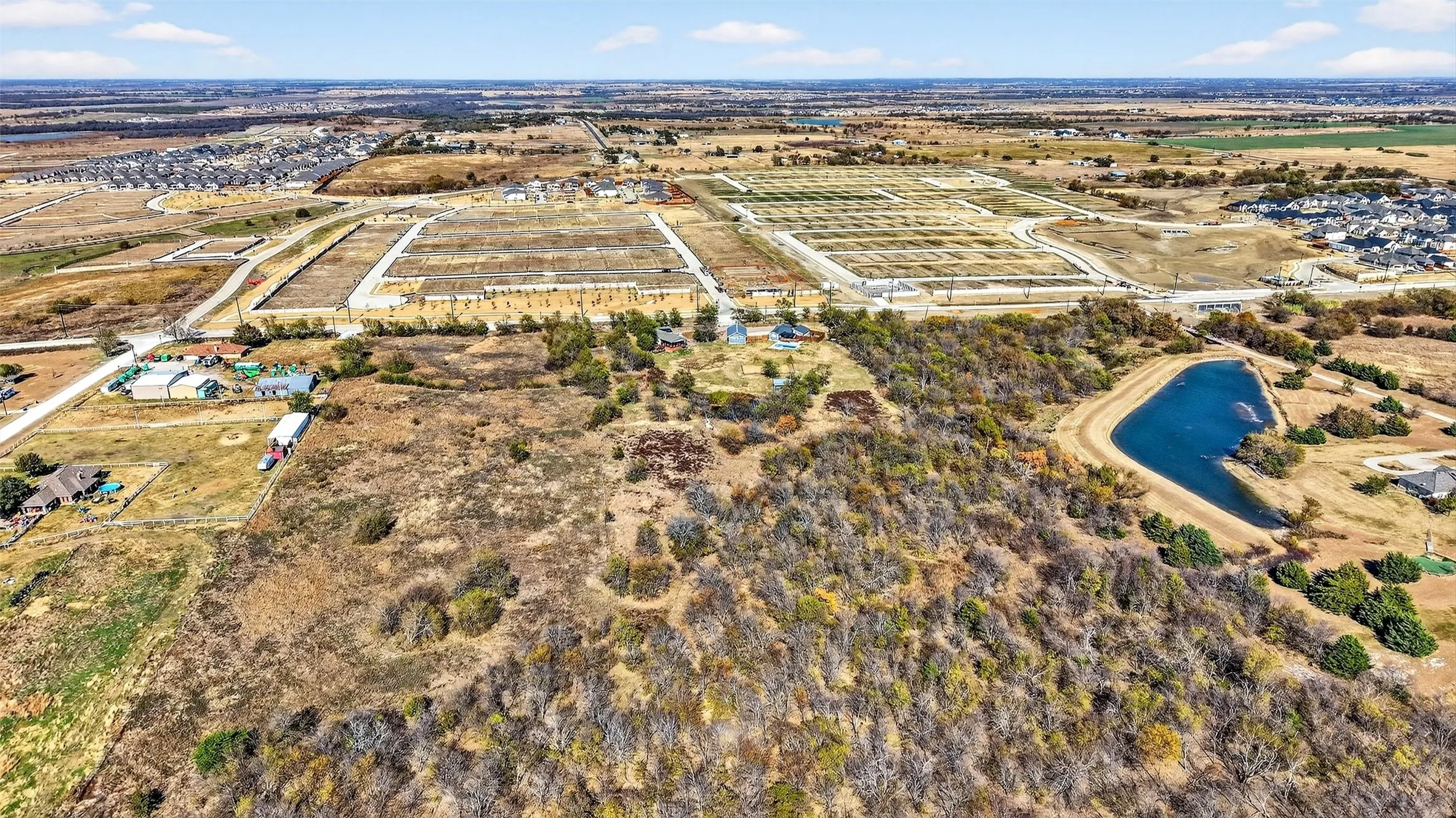 Aerial view of property's location with rural landscape and a nearby body of water
