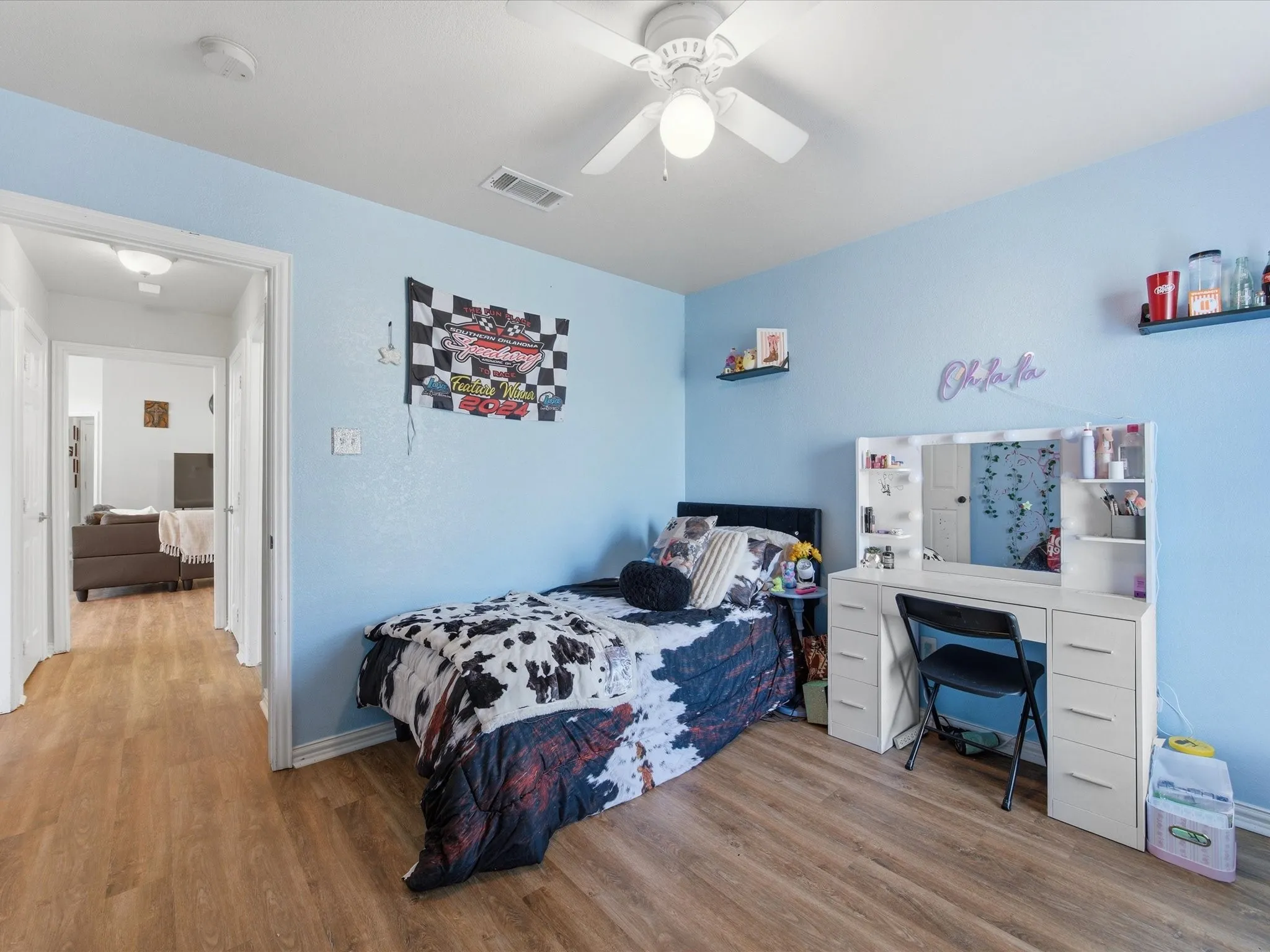 Bedroom with wood finished floors and ceiling fan