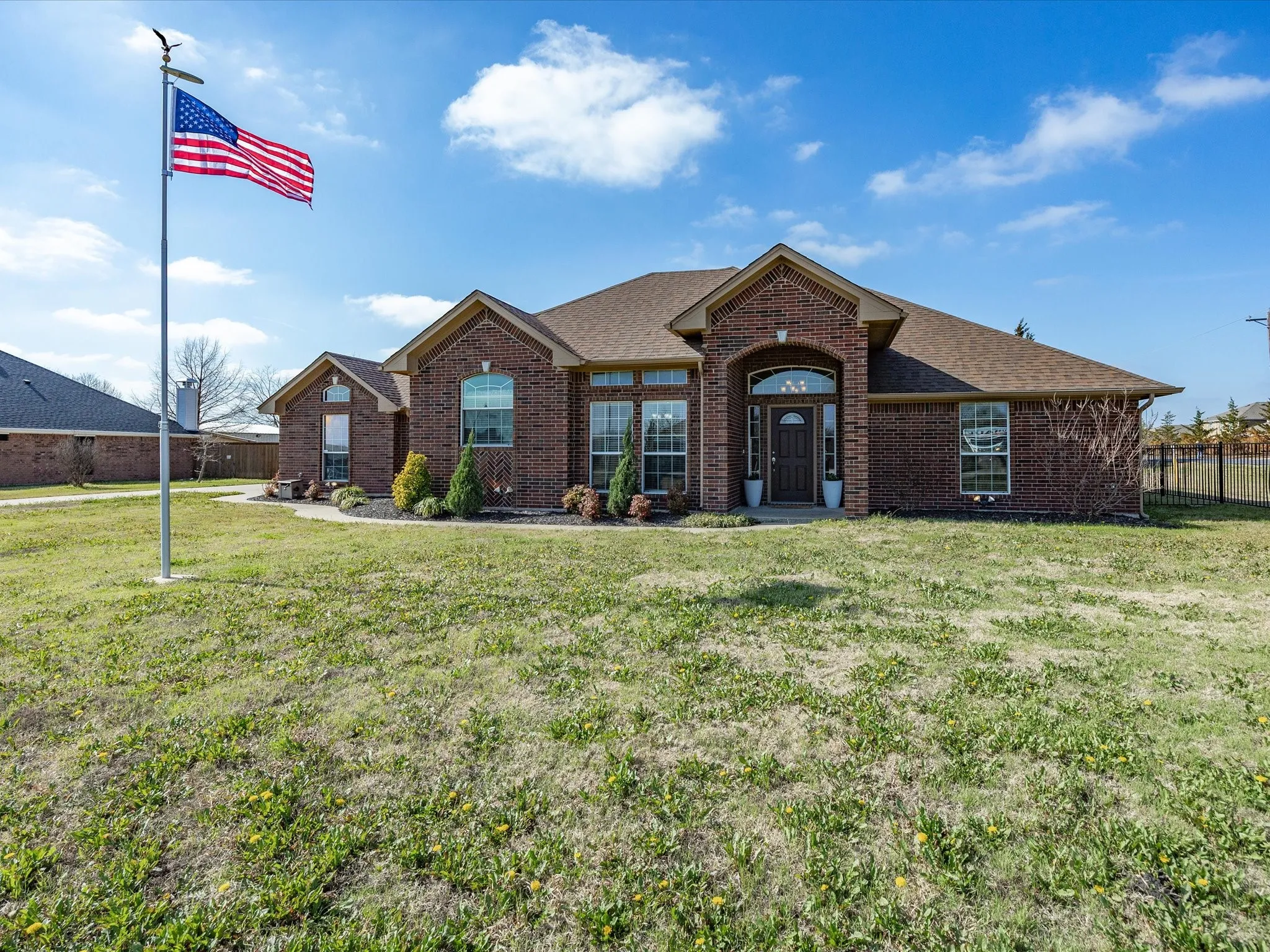 View of front of home featuring brick siding