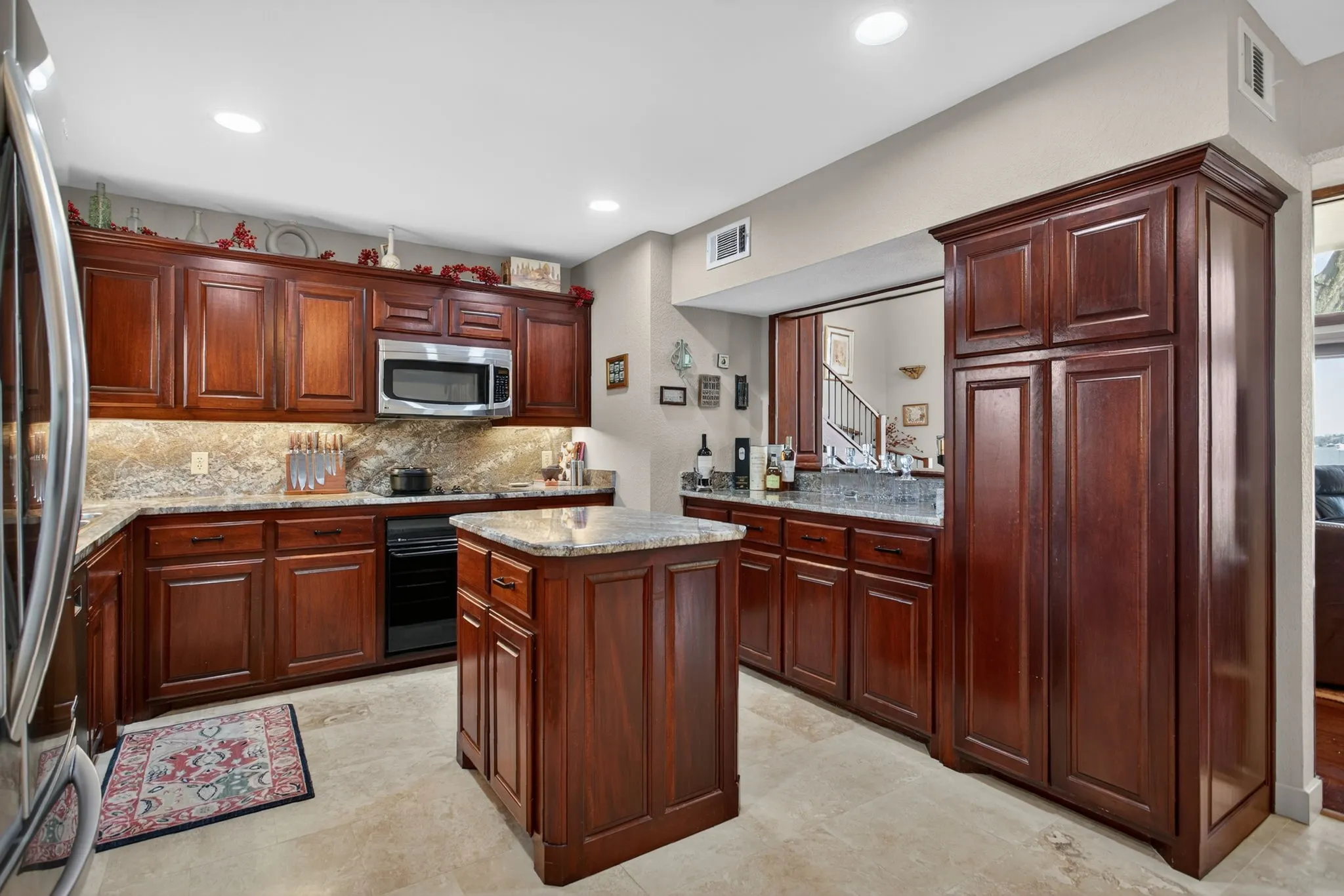Mahogany custom cabinets with moveable island