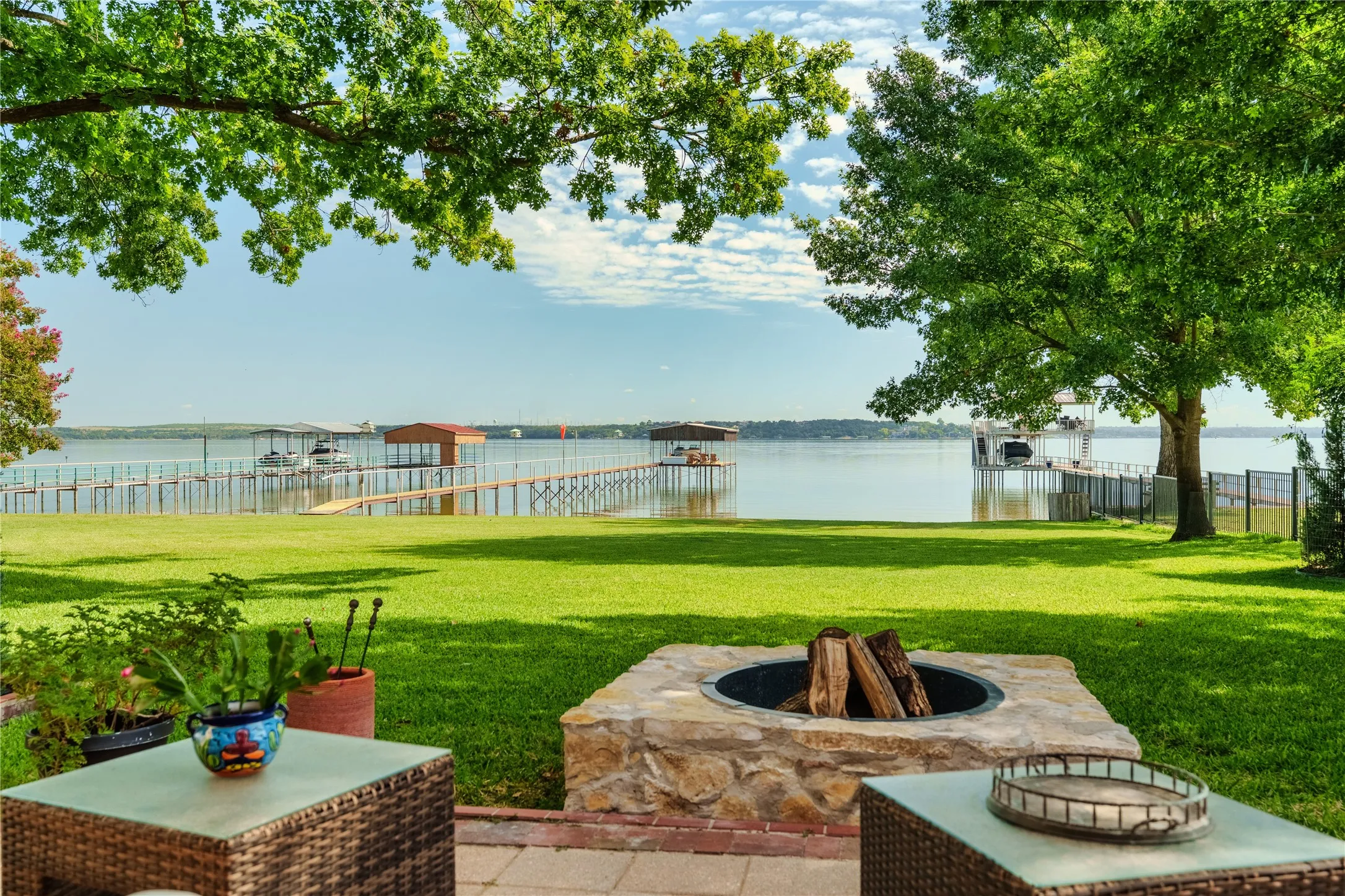 Patio view of firepit and lake