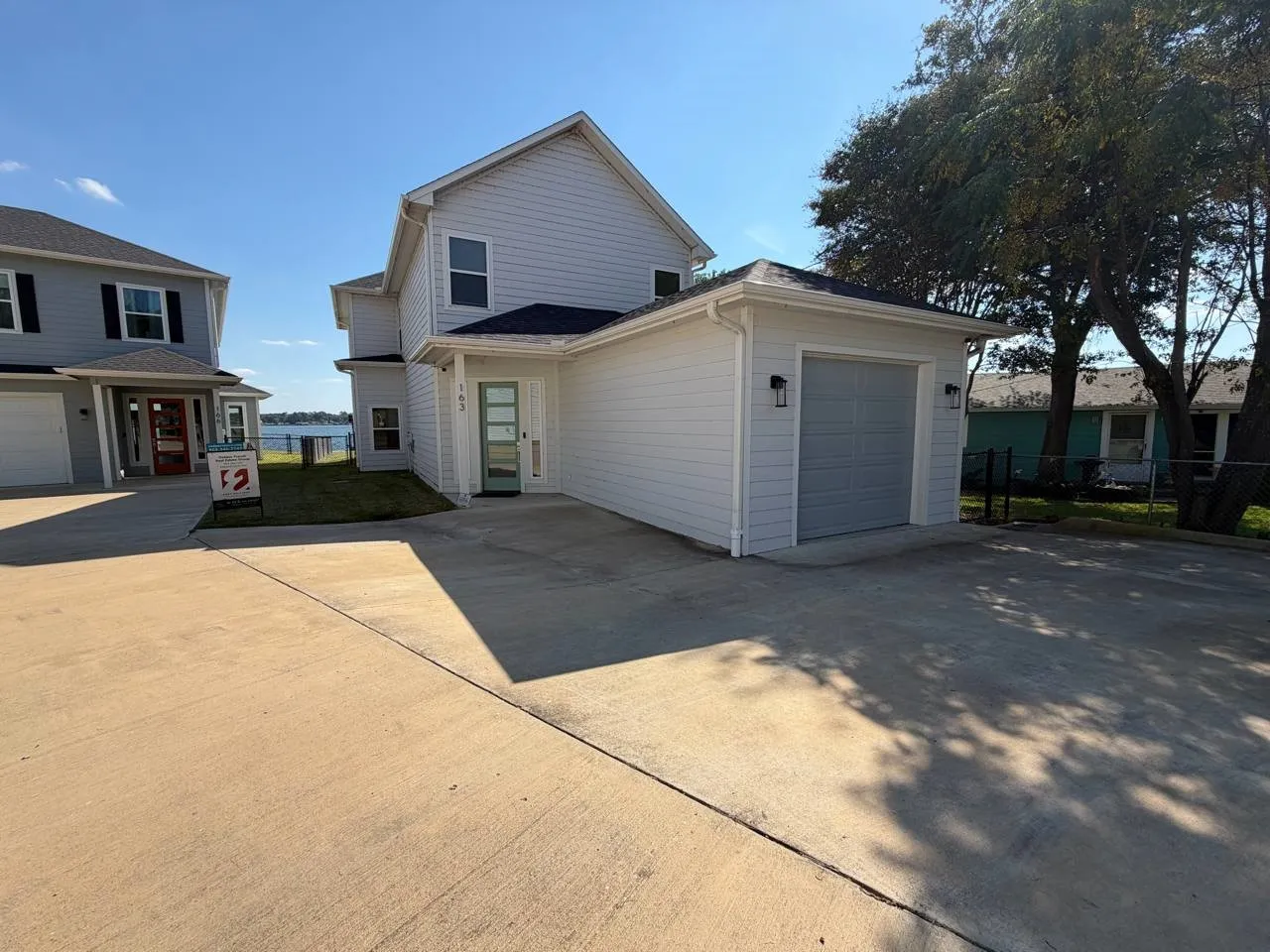 View of front of property featuring a garage and driveway