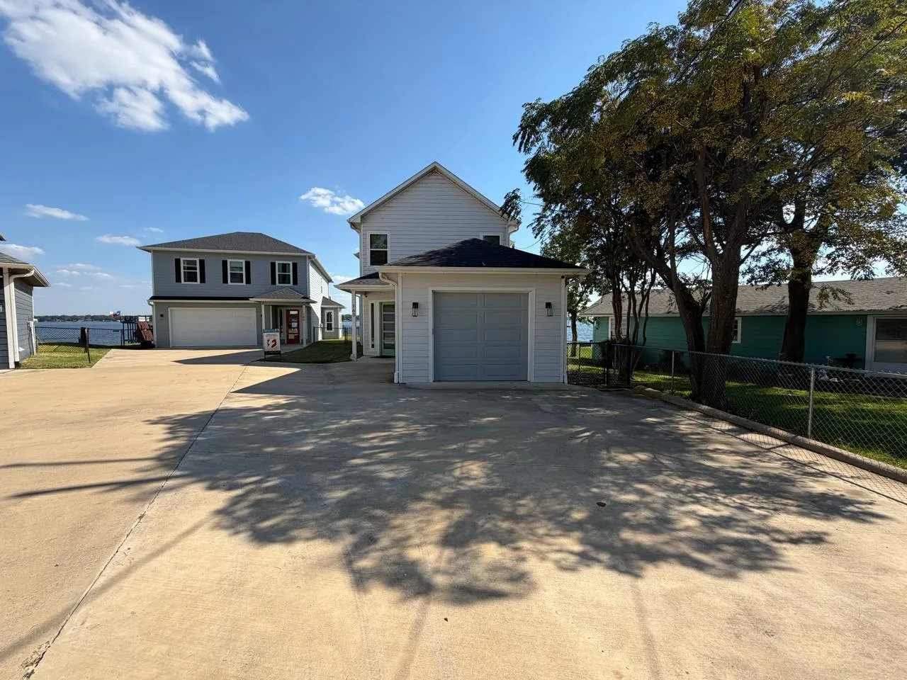 Traditional home featuring concrete driveway
