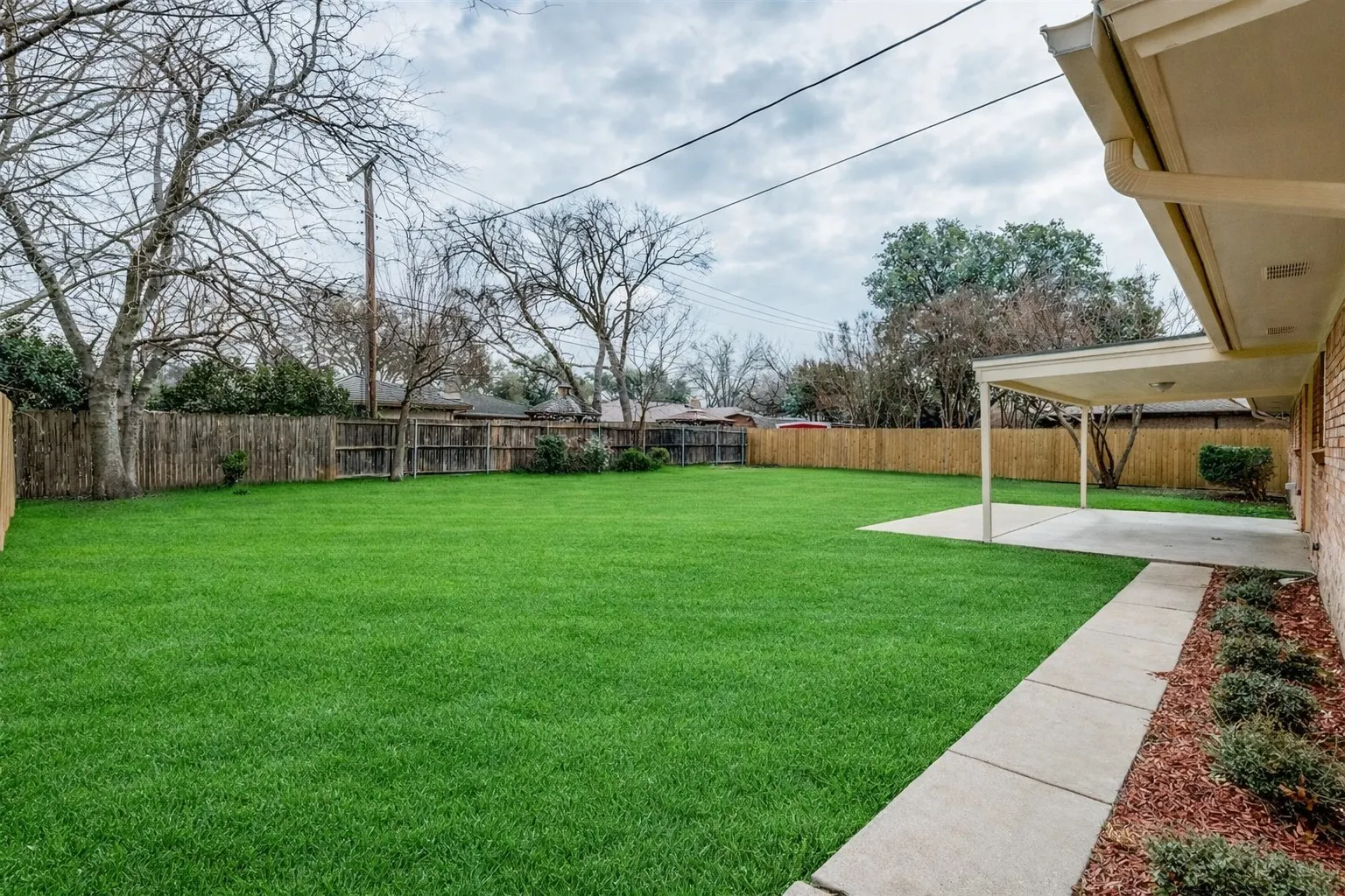 Huge backyard with nice sized covered patio.