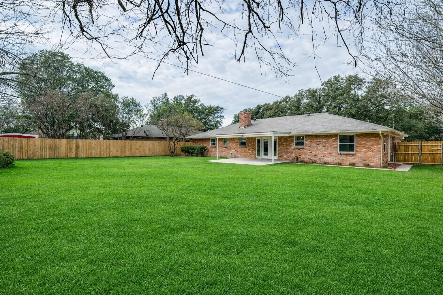 Huge backyard with nice sized covered patio.