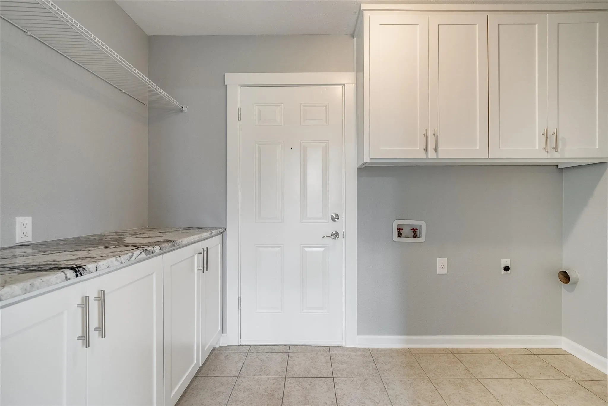 Cabinets galore in this big laundry room!