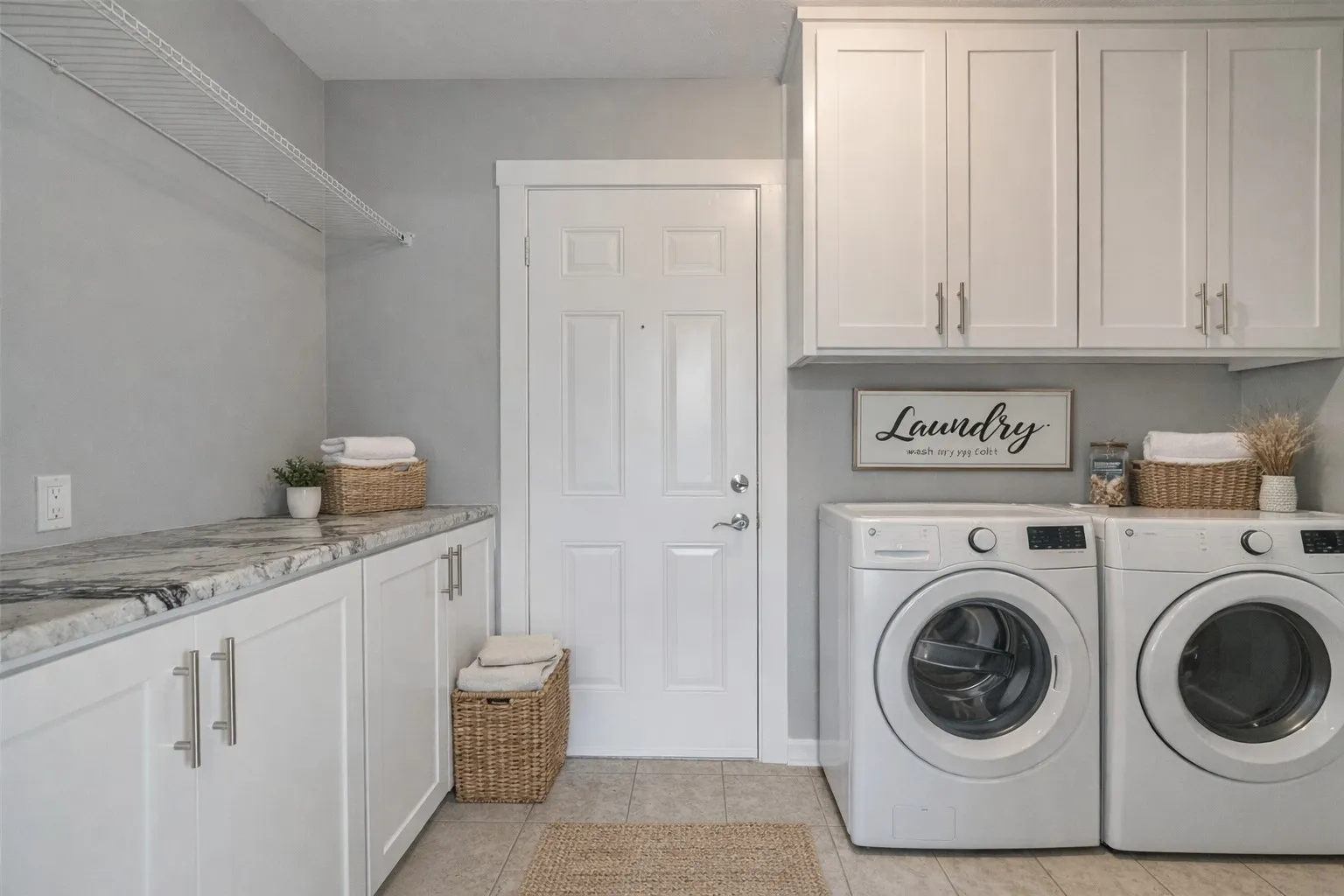 Cabinets galore in this big laundry room!
