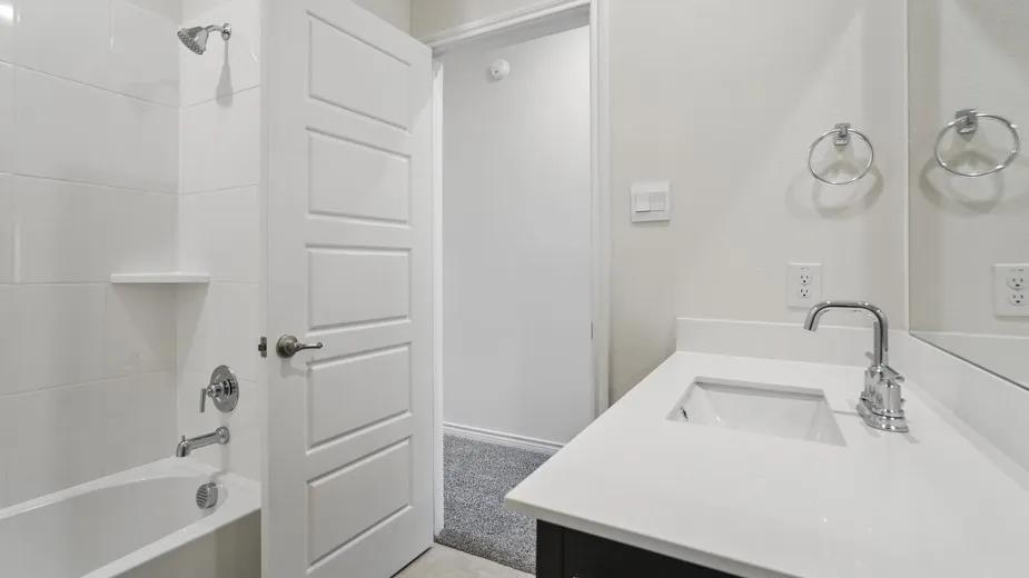 Bathroom vanity with a white countertop and undermount sink