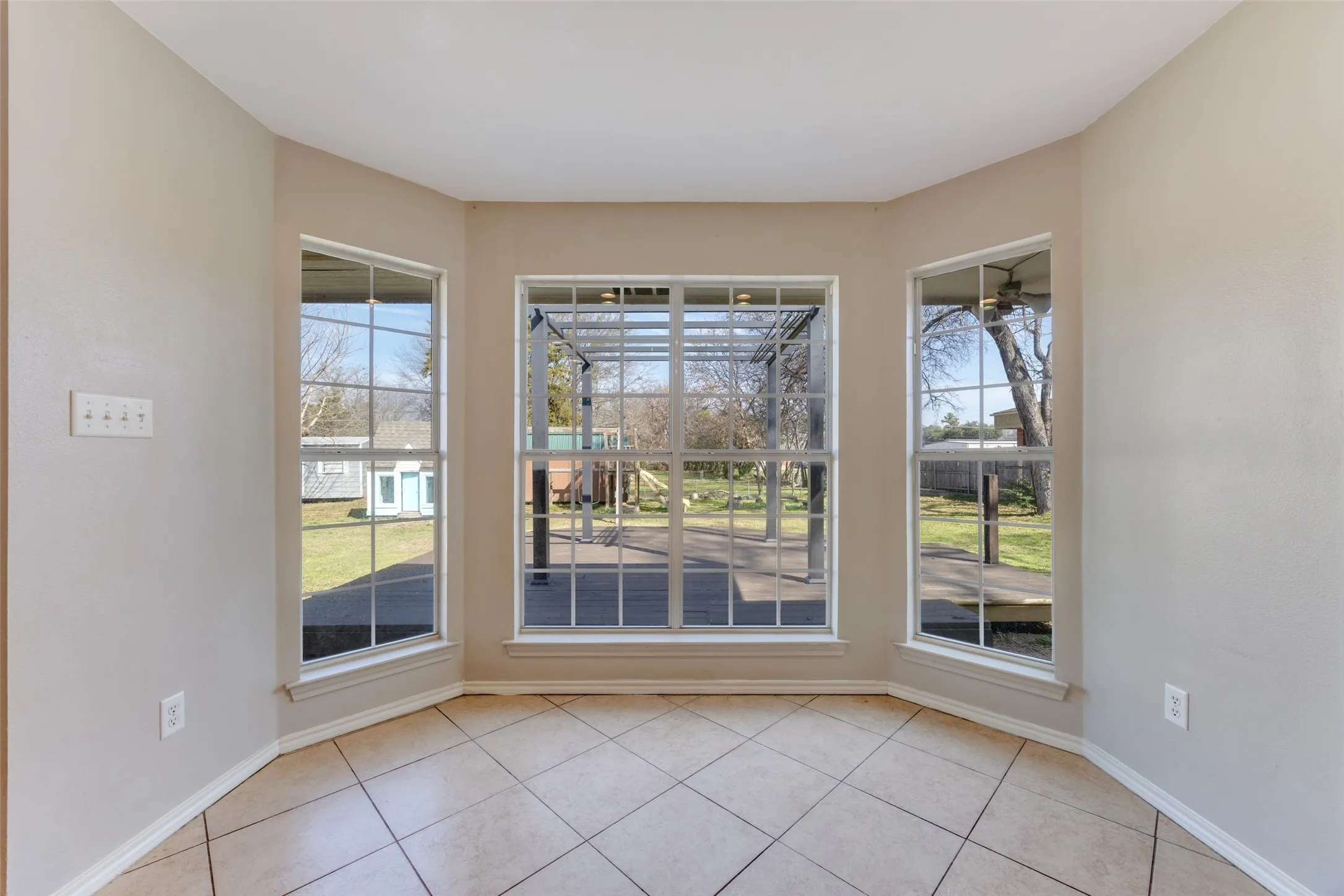 Unfurnished dining area with light tile patterned flooring