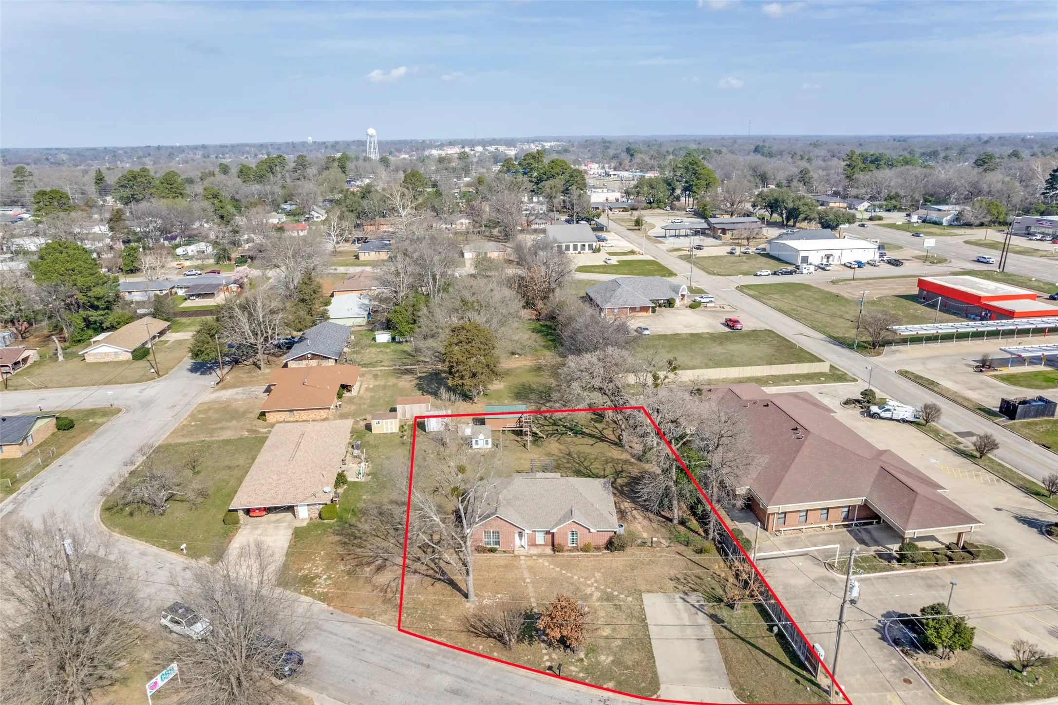 Aerial perspective of suburban area featuring property parcel outlined