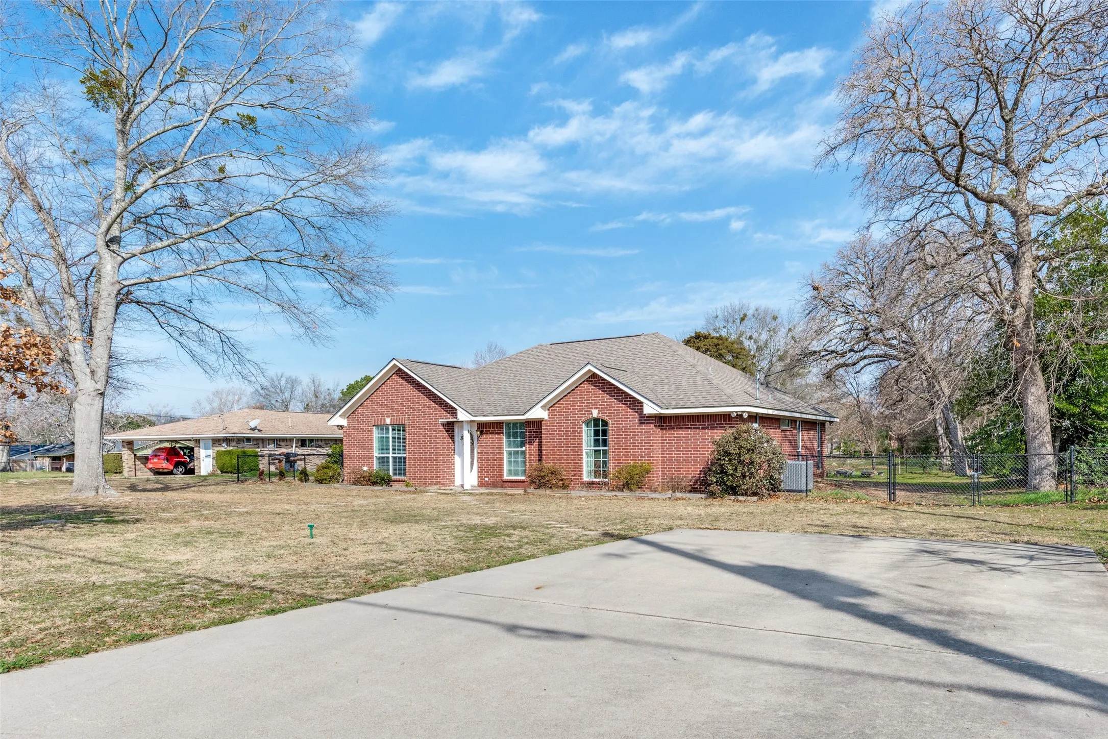 Single story home with brick siding