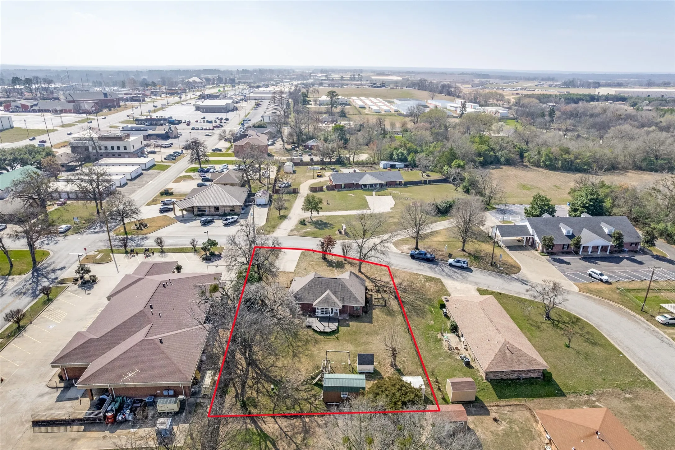 Aerial perspective of suburban area with property parcel outlined