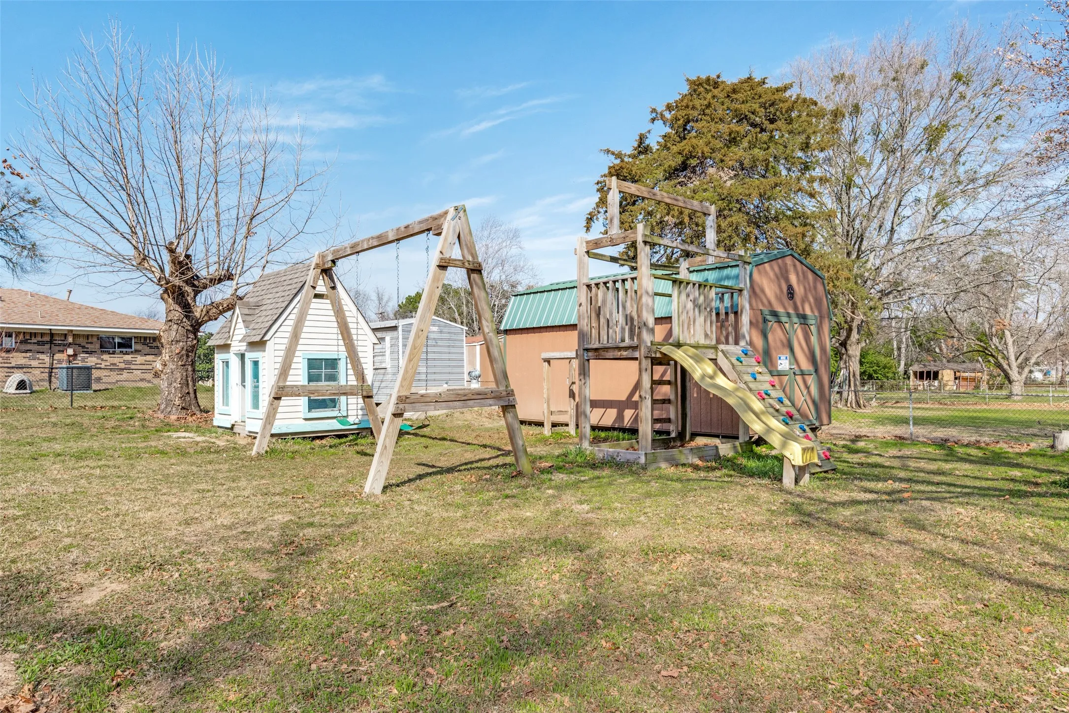 View of playground with an outbuilding