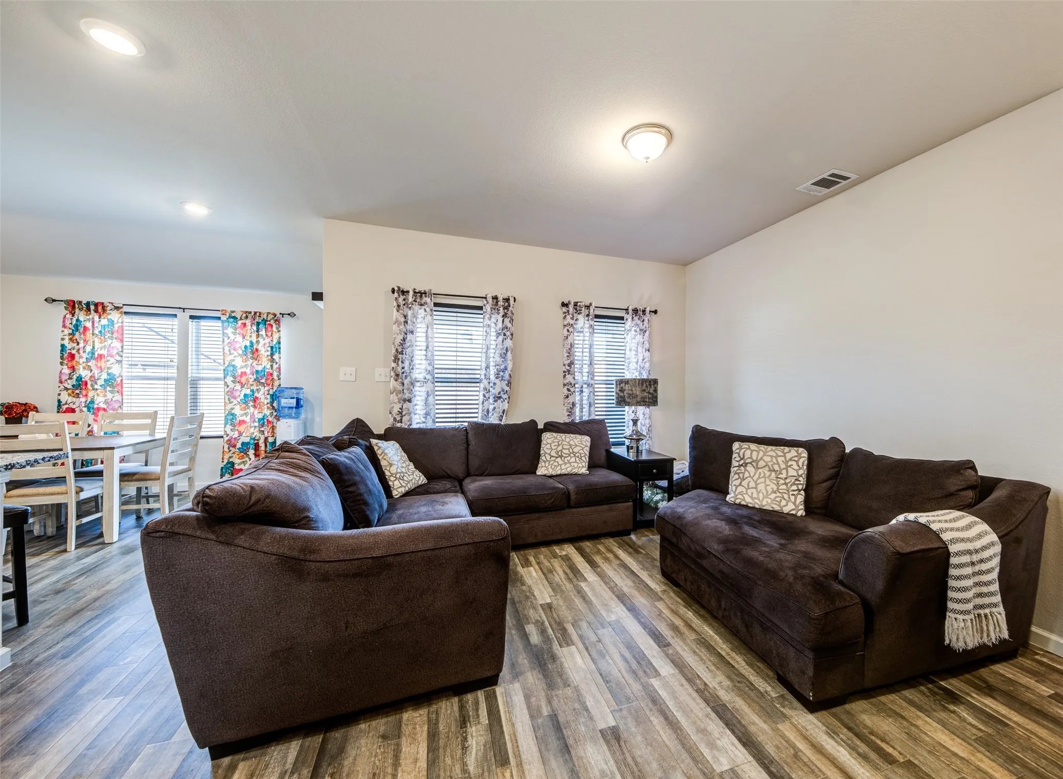 Living room featuring wood finished floors and recessed lighting