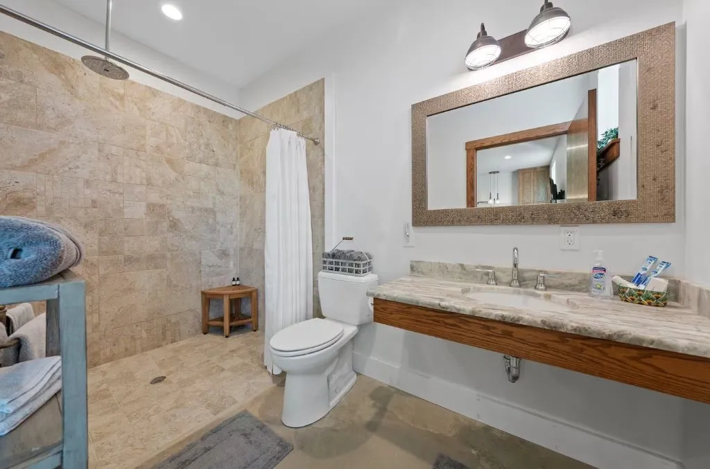 Bathroom featuring walk in shower and recessed lighting