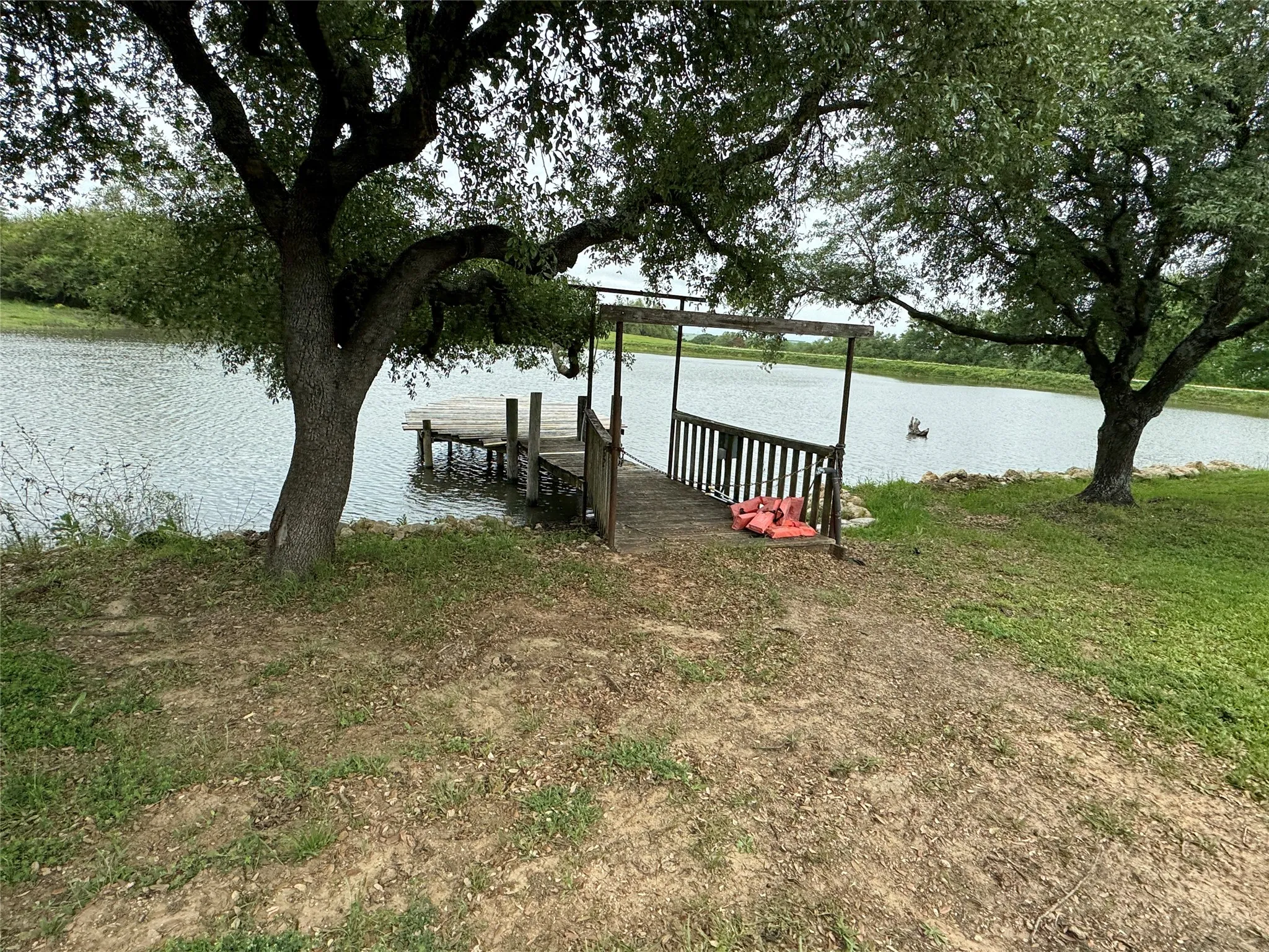 Dock area featuring a water view