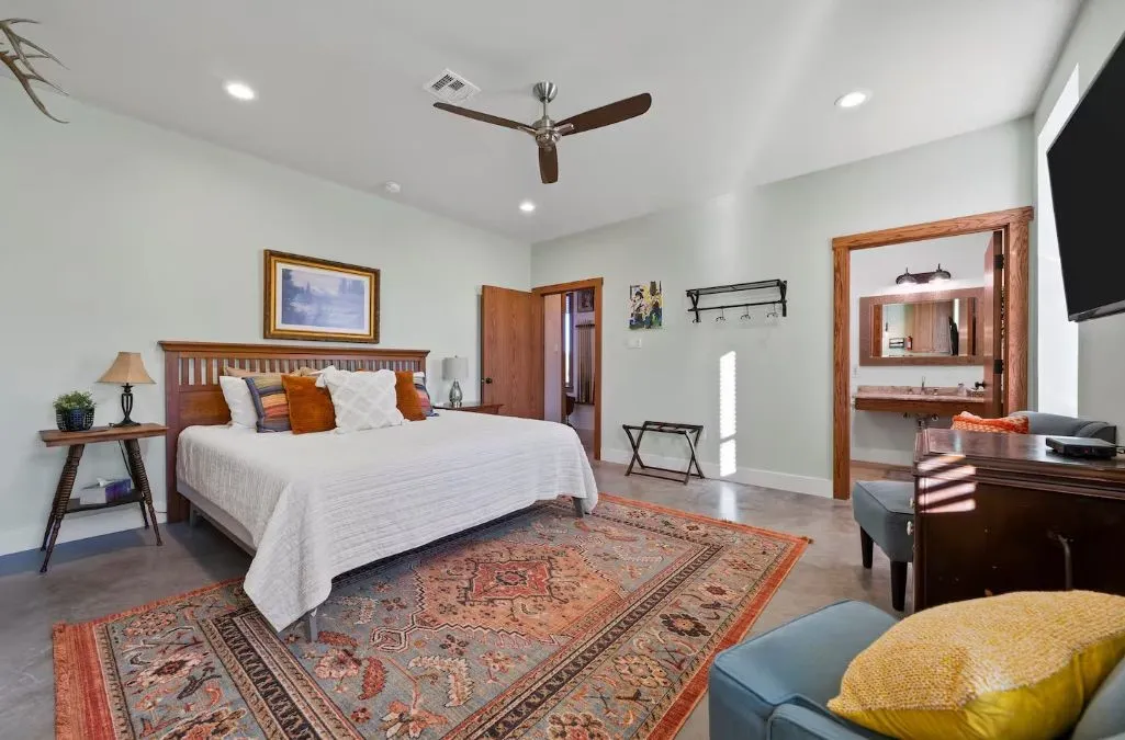 Bedroom featuring finished concrete flooring, recessed lighting, and ceiling fan