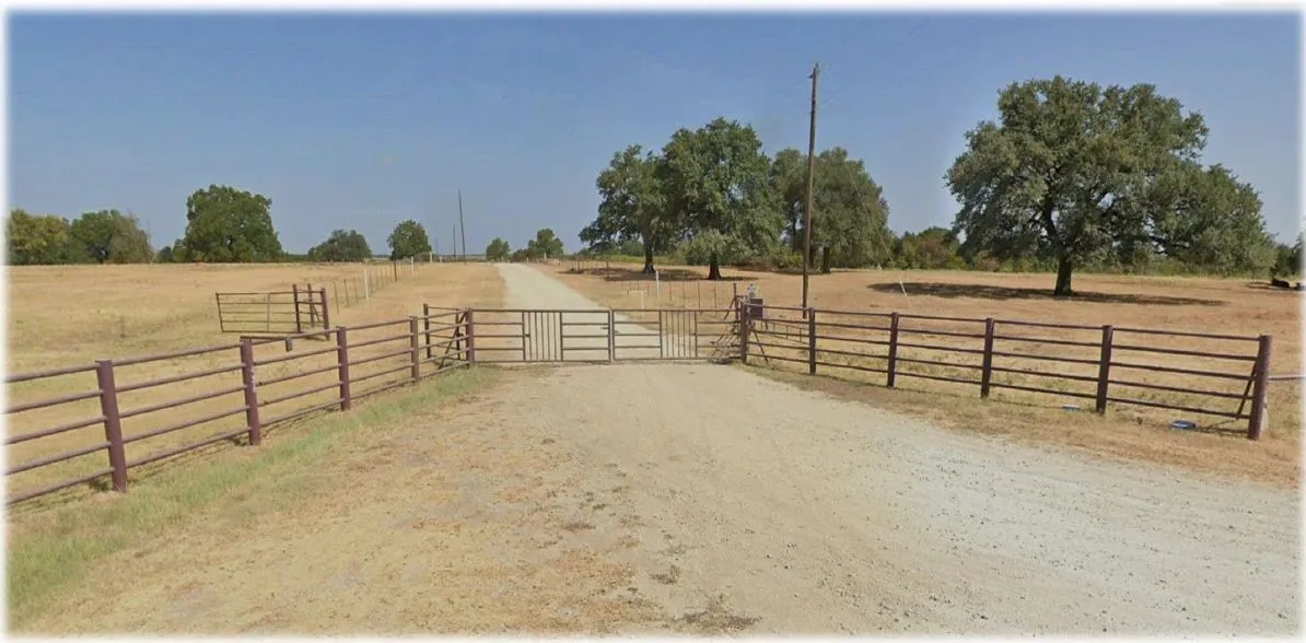 View of yard featuring a view of countryside and an enclosed horse arena