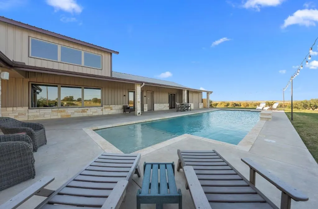 Outdoor pool with a patio area