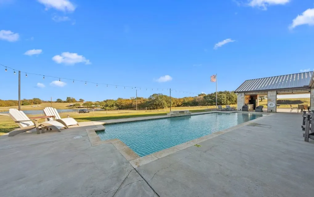 Outdoor pool with a patio area