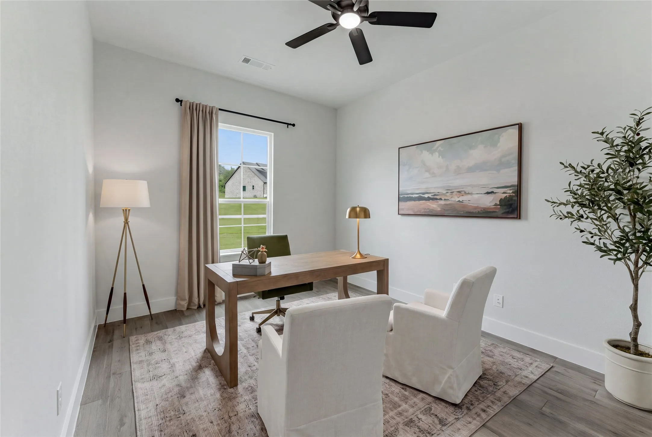Recessed lighting, wood-finish flooring, and a ceiling fan create a comfortable​​‌​​​​‌​​‌‌​‌‌​​​‌‌​‌​‌​‌​​​‌​​ atmosphere
