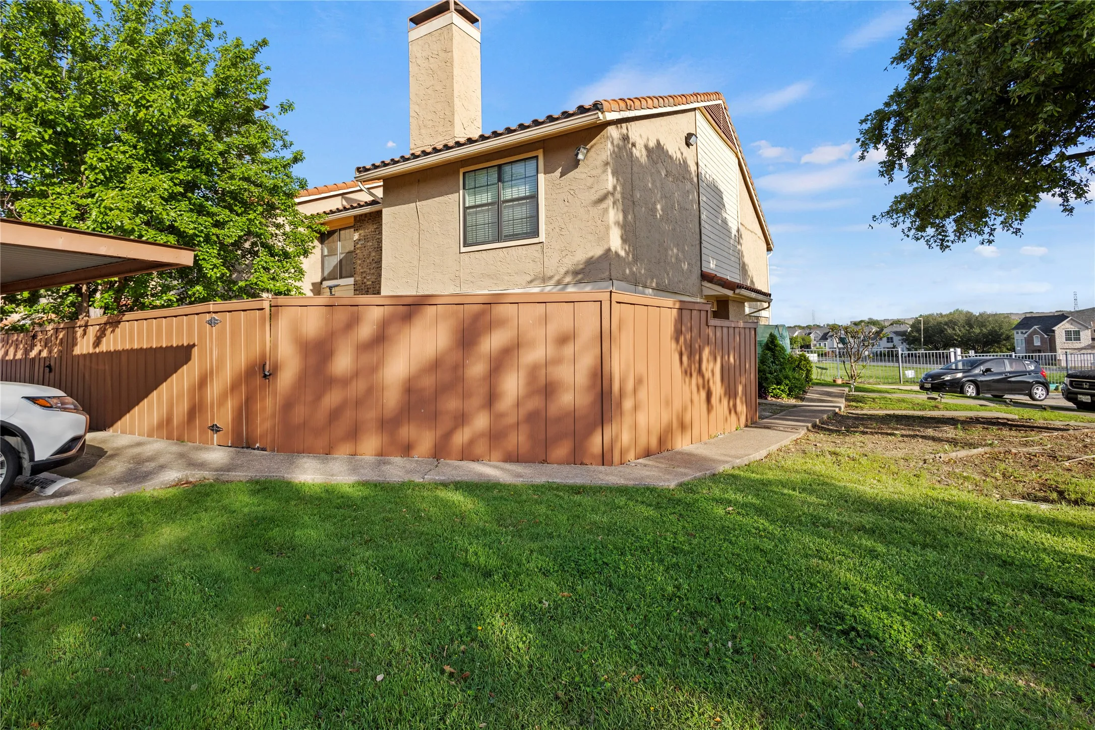 View of side of home with a yard