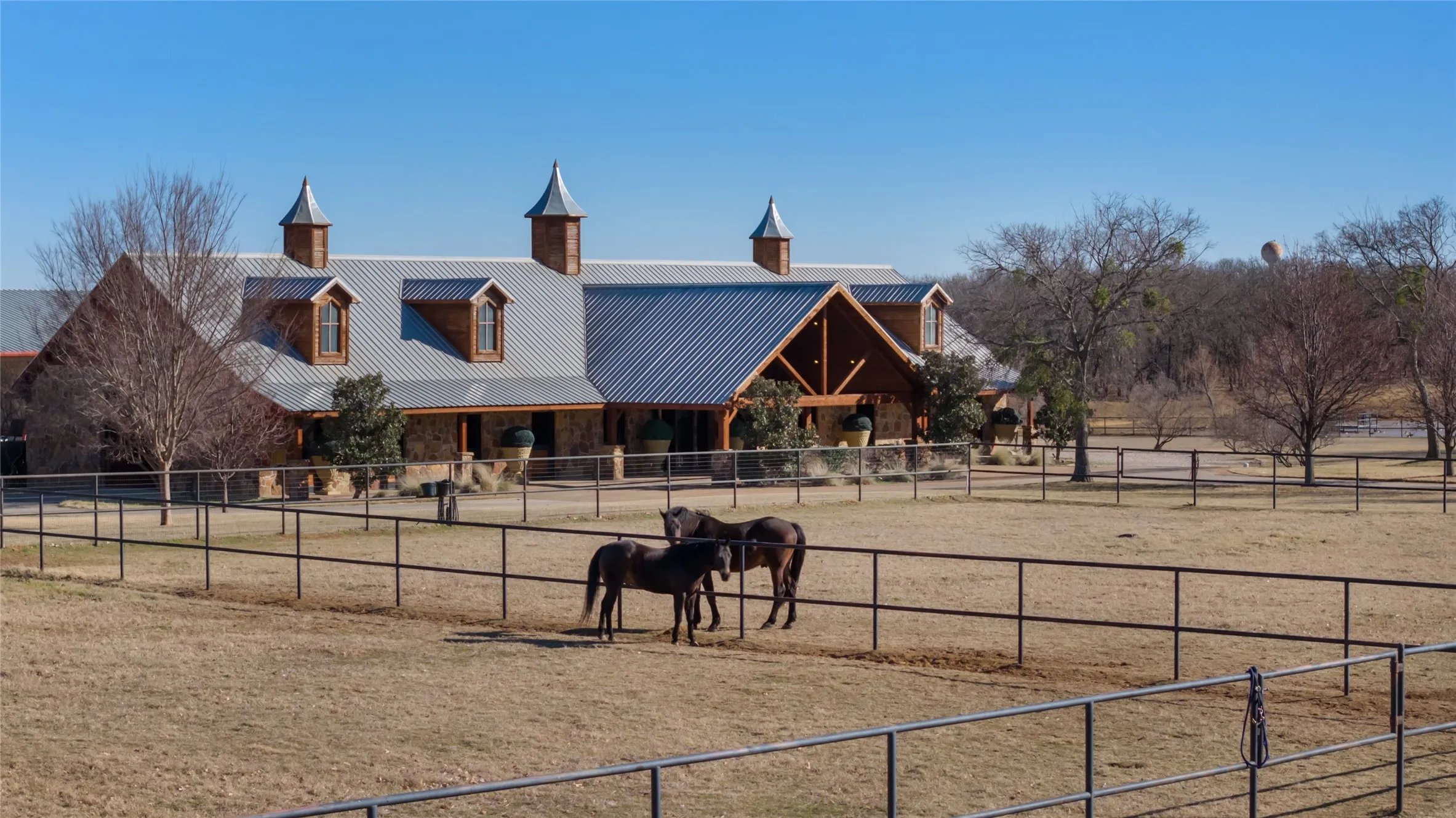 Main Horse Barn with 10 Stalls, Tack and Trophy Room