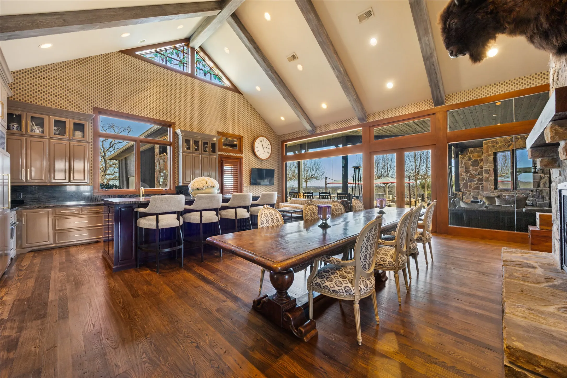 Ample Cabinets and Drawers, Warming Drawer, Ice Maker Sub Zero Refrigerator and Freezer, Island with Cabinets and Drawers. Breakfast Room Seating by Windows. Custom Laquer Paint