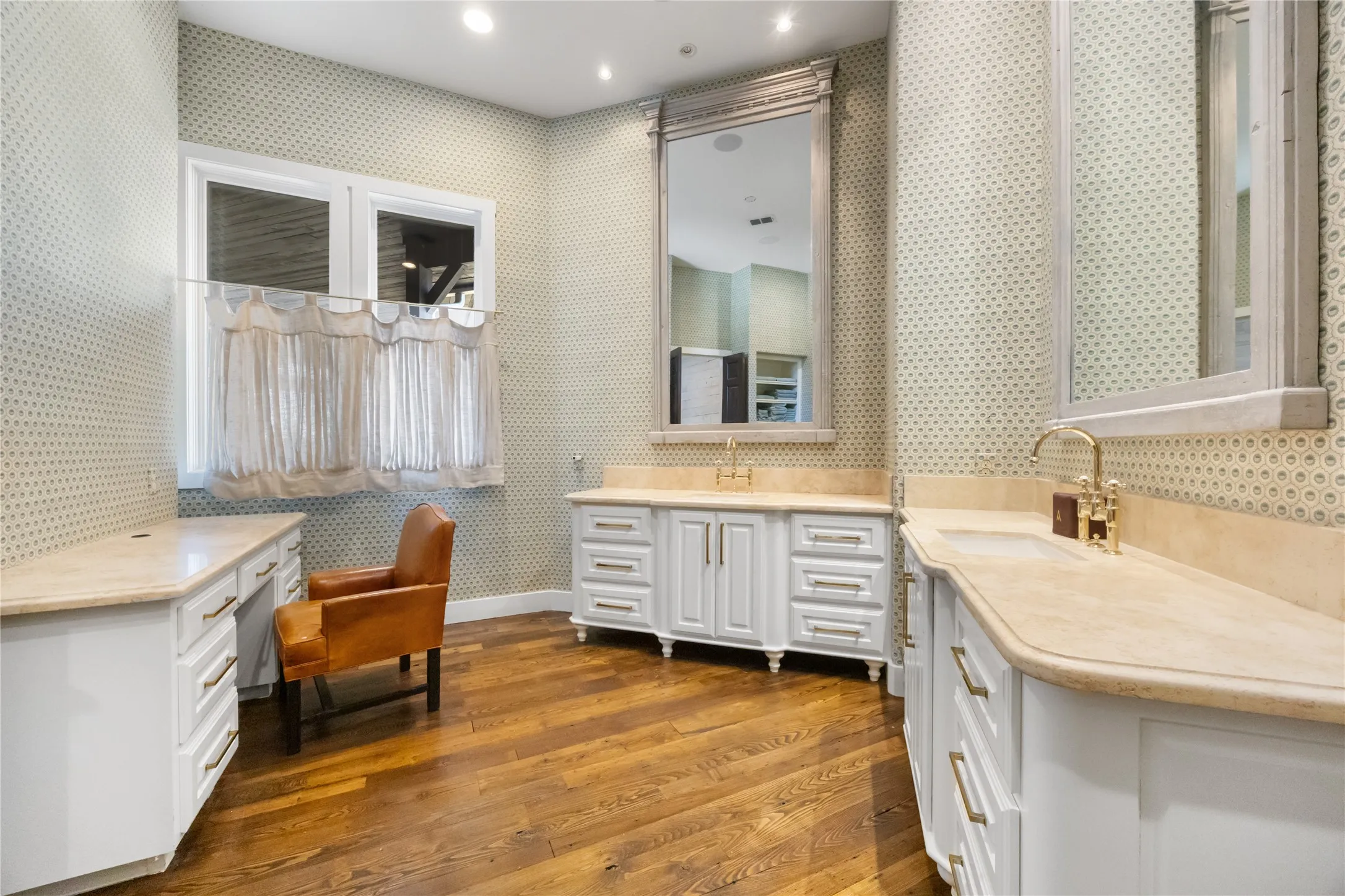 Dual Vanities with Mirrors to Scale for 11 ft Ceilings. Seating. Shower in Primary Bath.