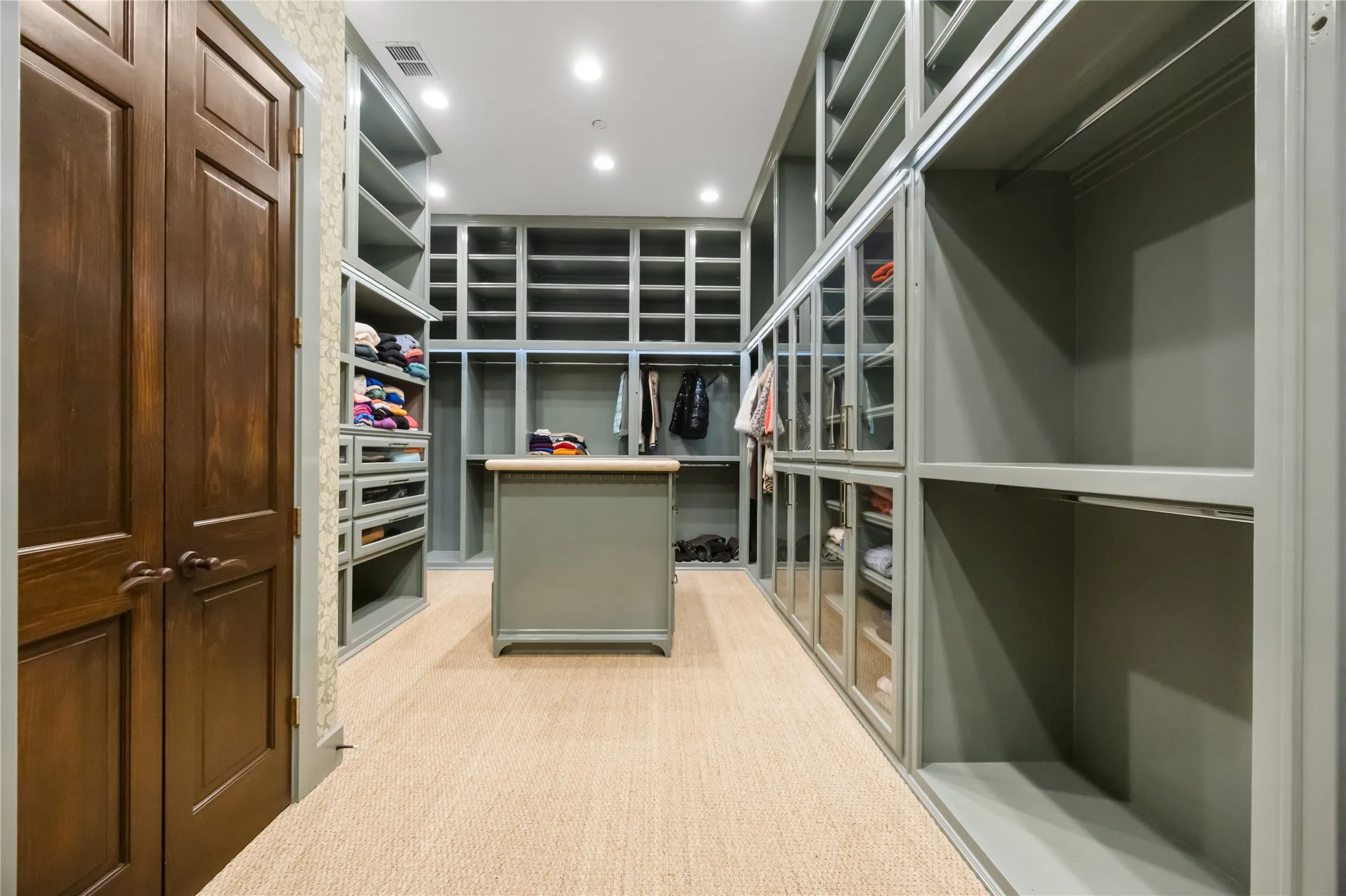 Showroom Walk in Closet with Large Island with Drawers. Made to Measure Ample Rods, Drawers and Cubbies Custom Paint