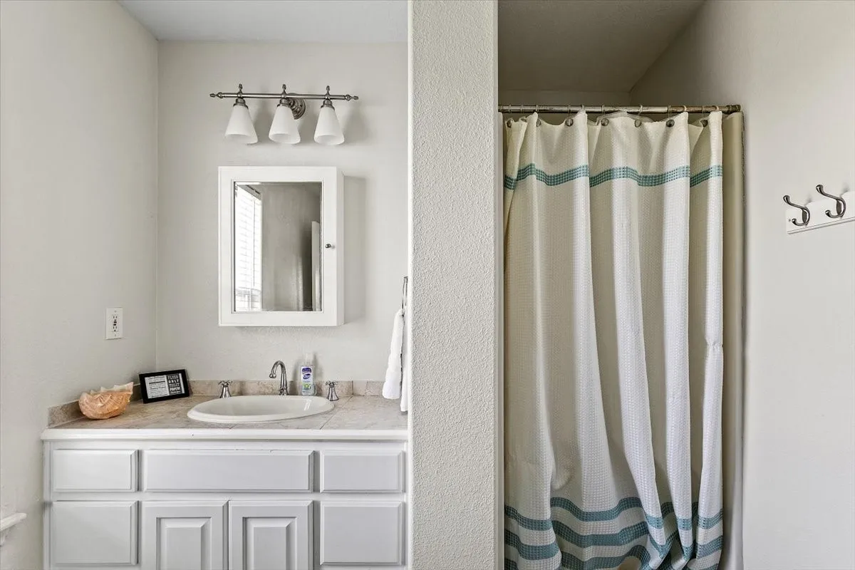 Bathroom with walk in shower and vanity