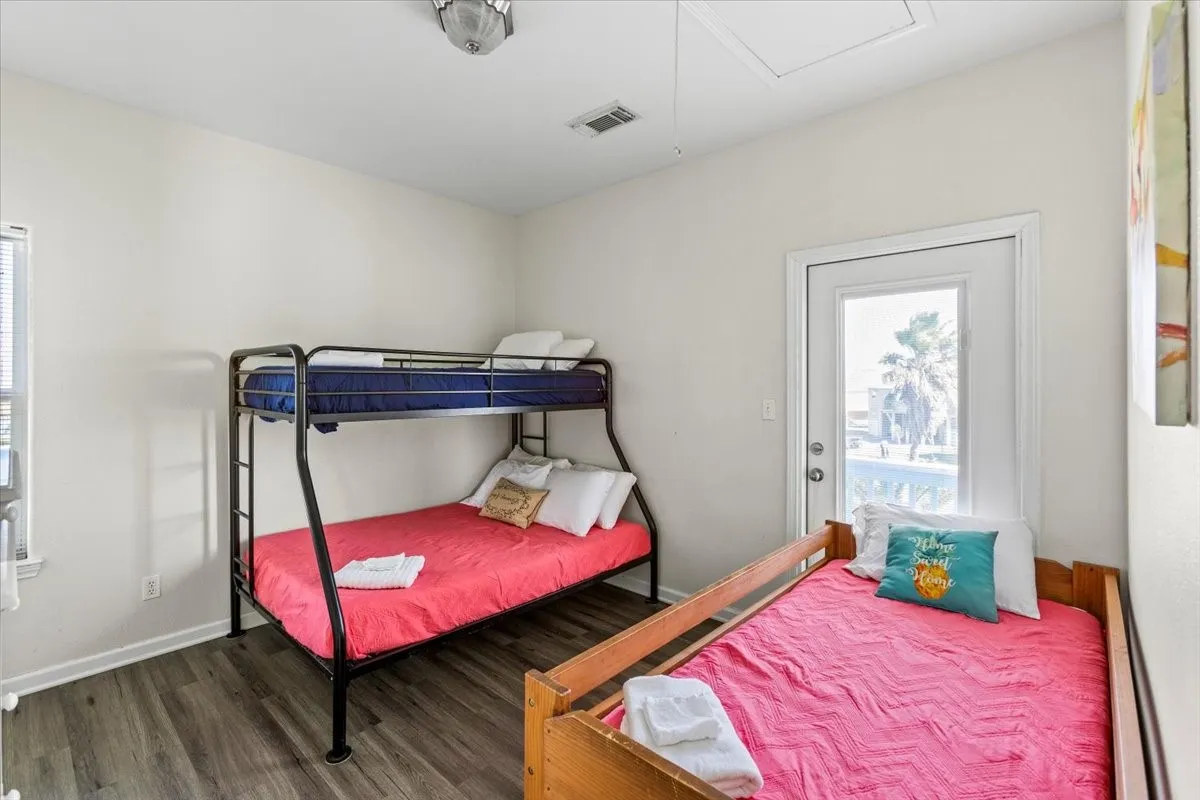 Bedroom featuring dark wood-type flooring