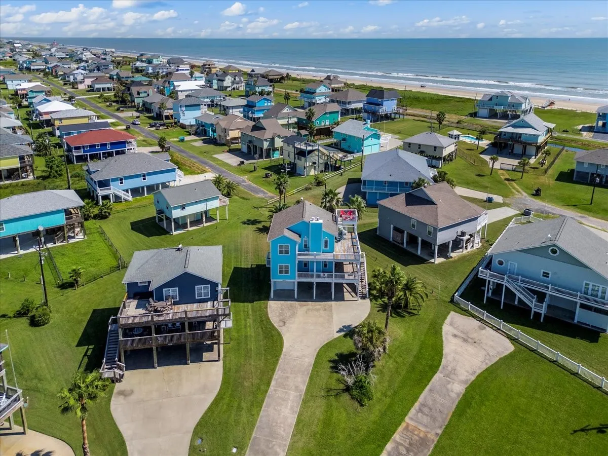 Aerial view with a water view and a beach view