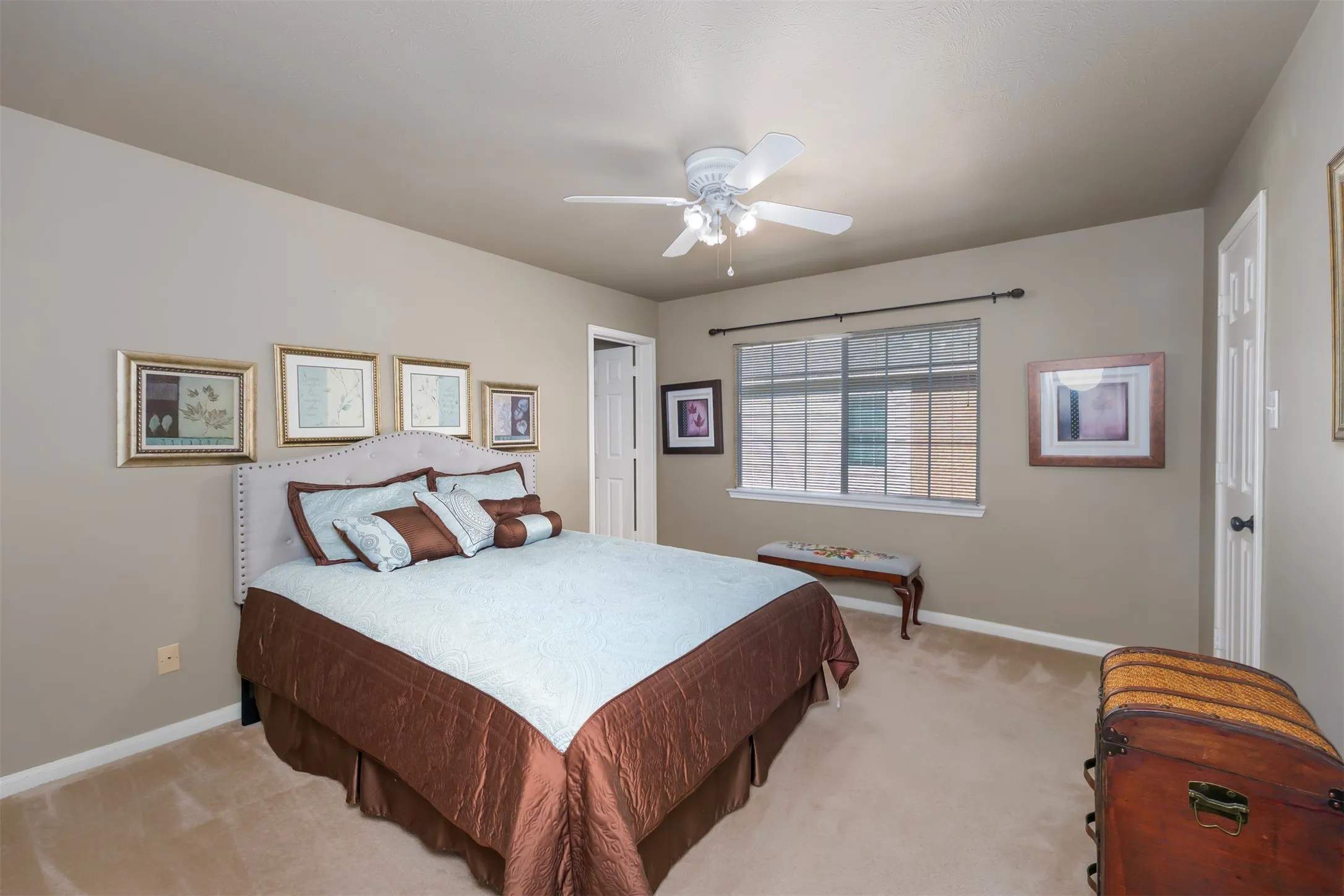 Bedroom with carpet floors and a ceiling fan