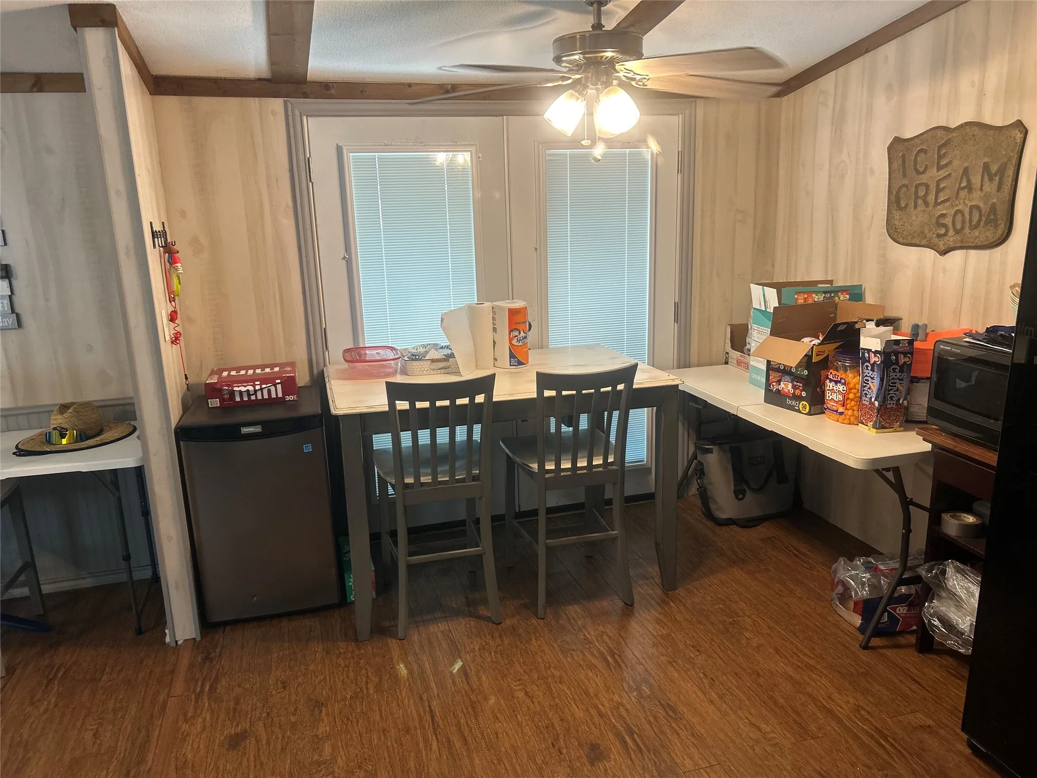 Dining room featuring wood finished floors and a ceiling fan