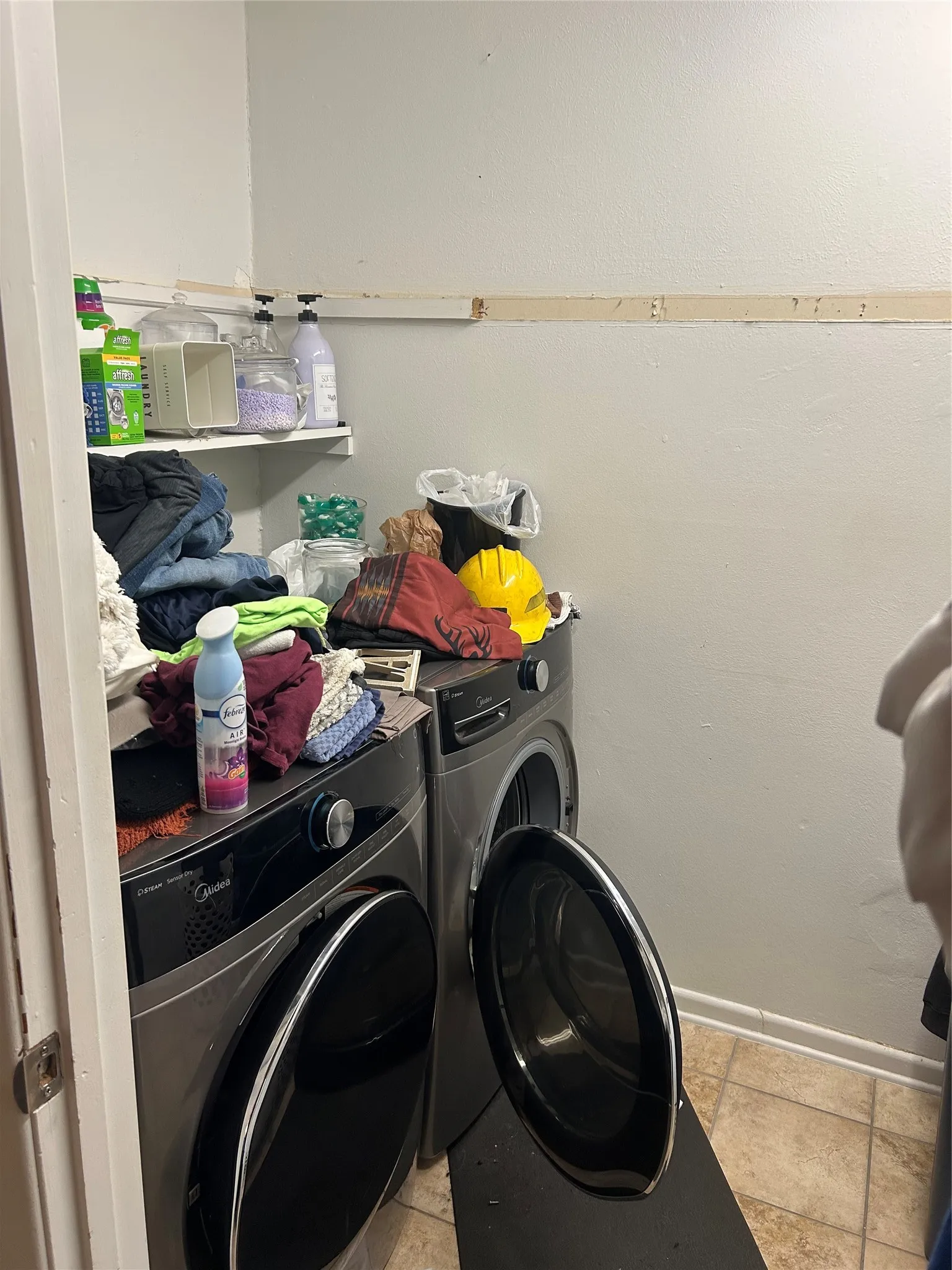 Laundry room featuring independent washer and dryer in the primary bedroom