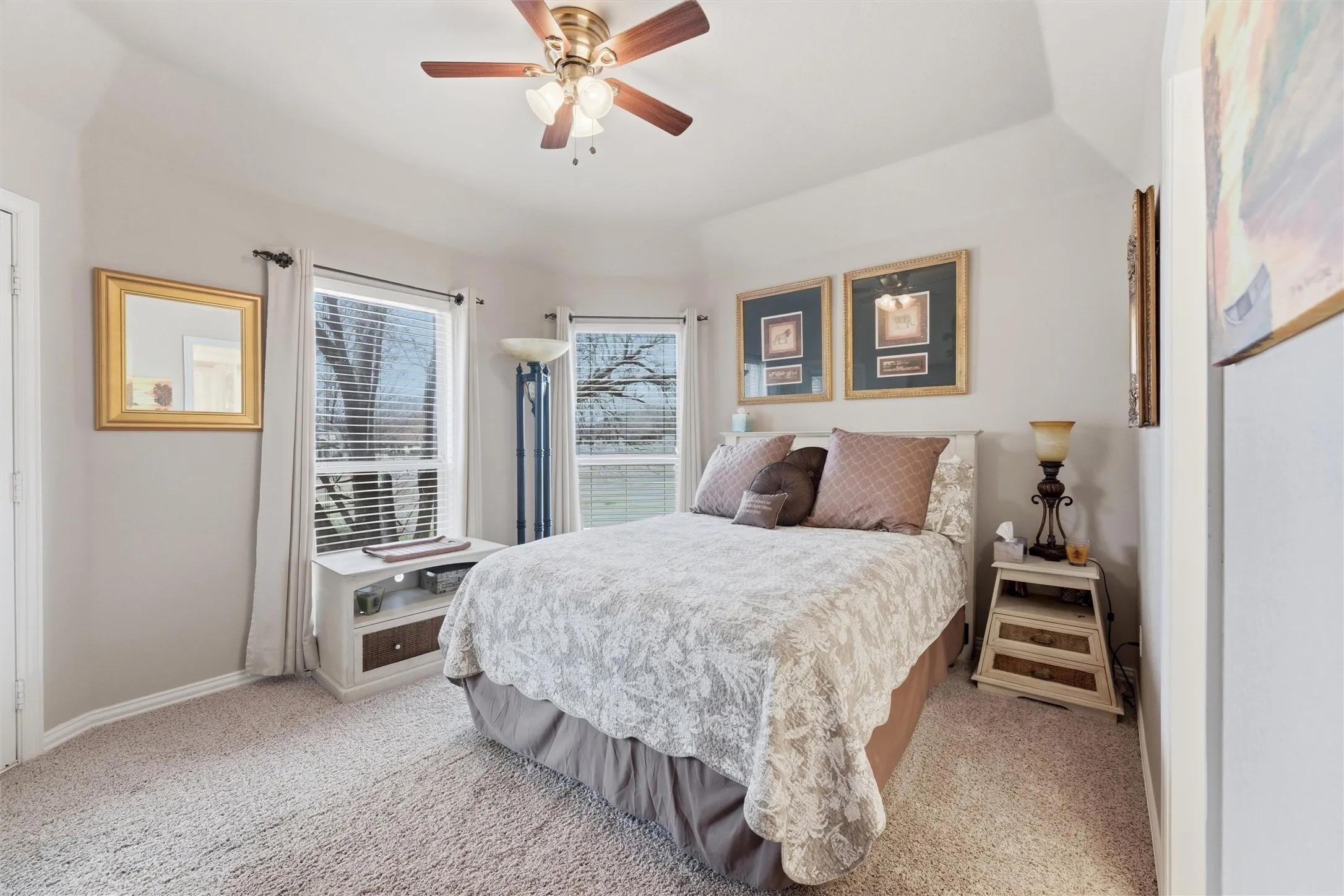Bedroom featuring ceiling fan and light carpet
