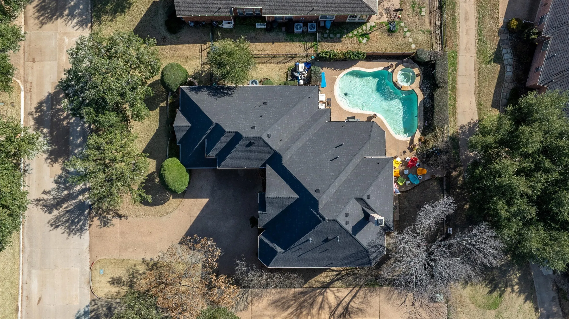 View of subject property featuring a pool